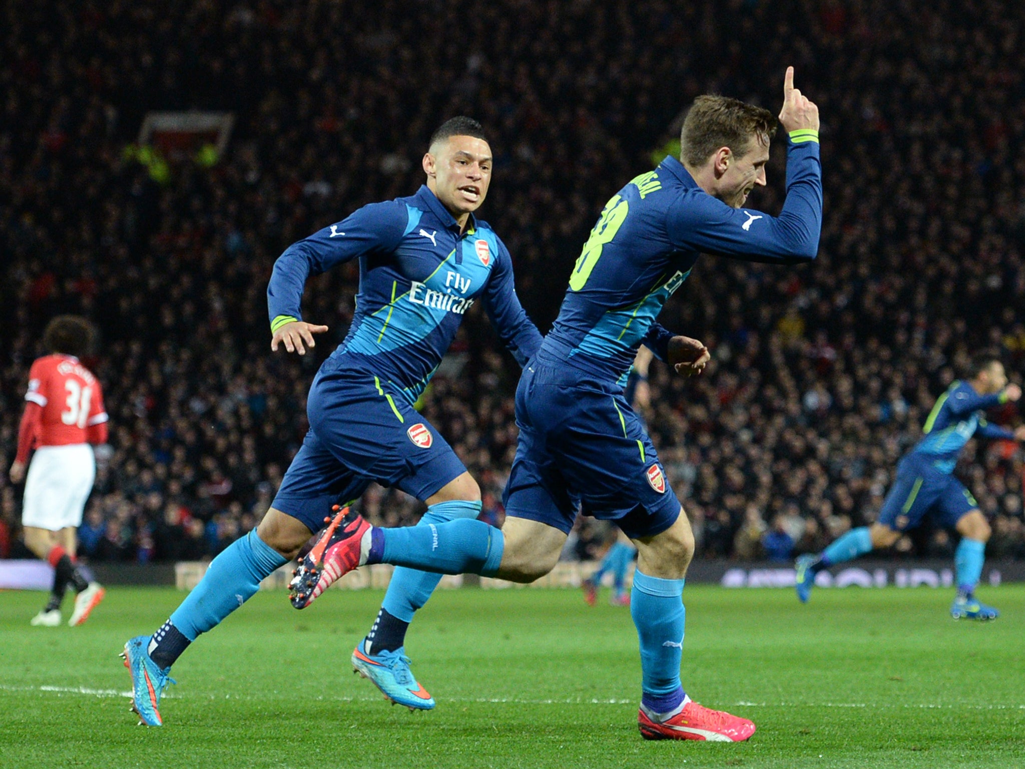 Nacho Monreal celebrates scoring the opening goal with Arsenal's English midfielder Alex Oxlade-Chamberlain