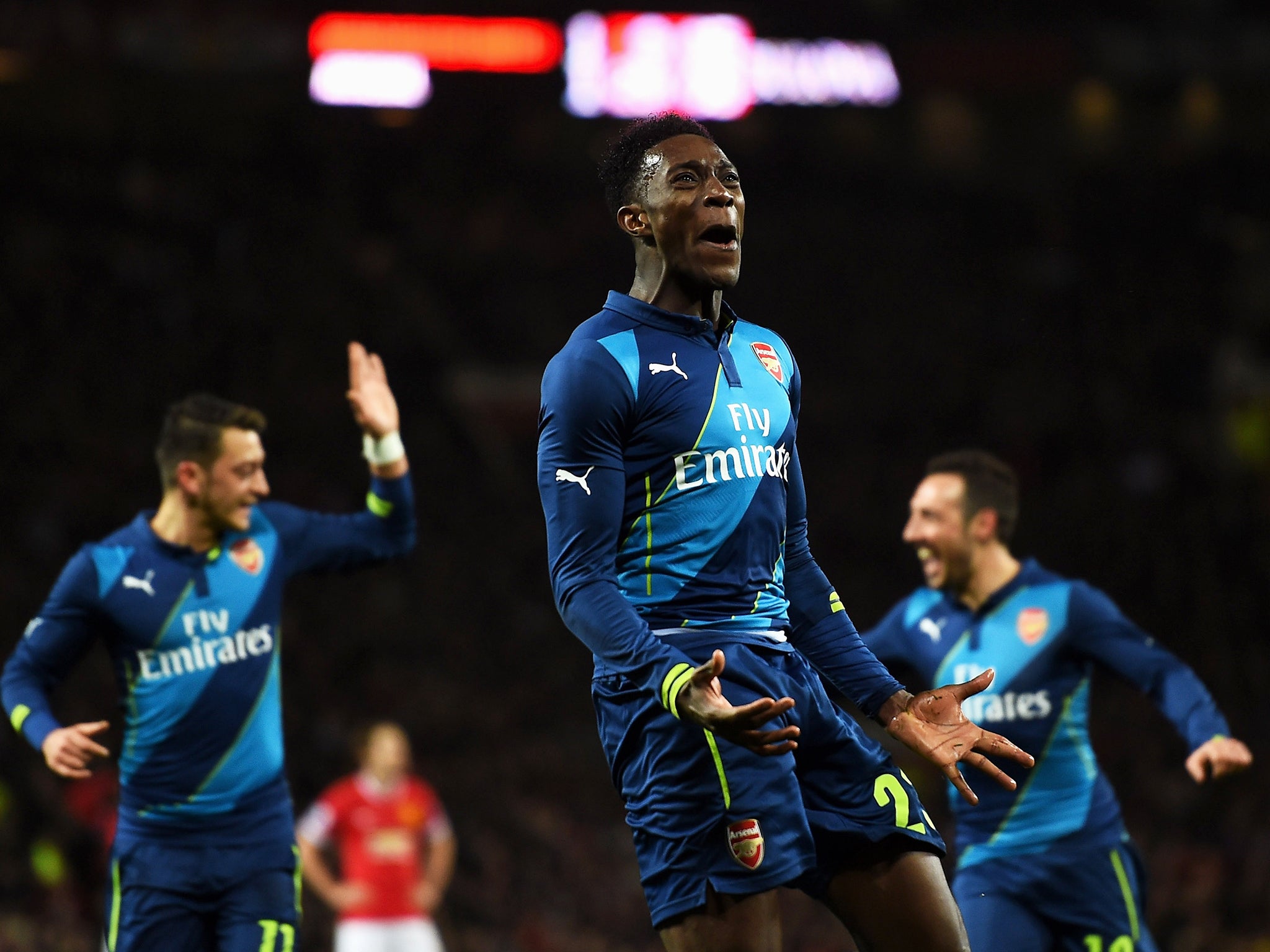 Danny Welbeck celebrates after making it 2-1 for Arsenal at Manchester United in March