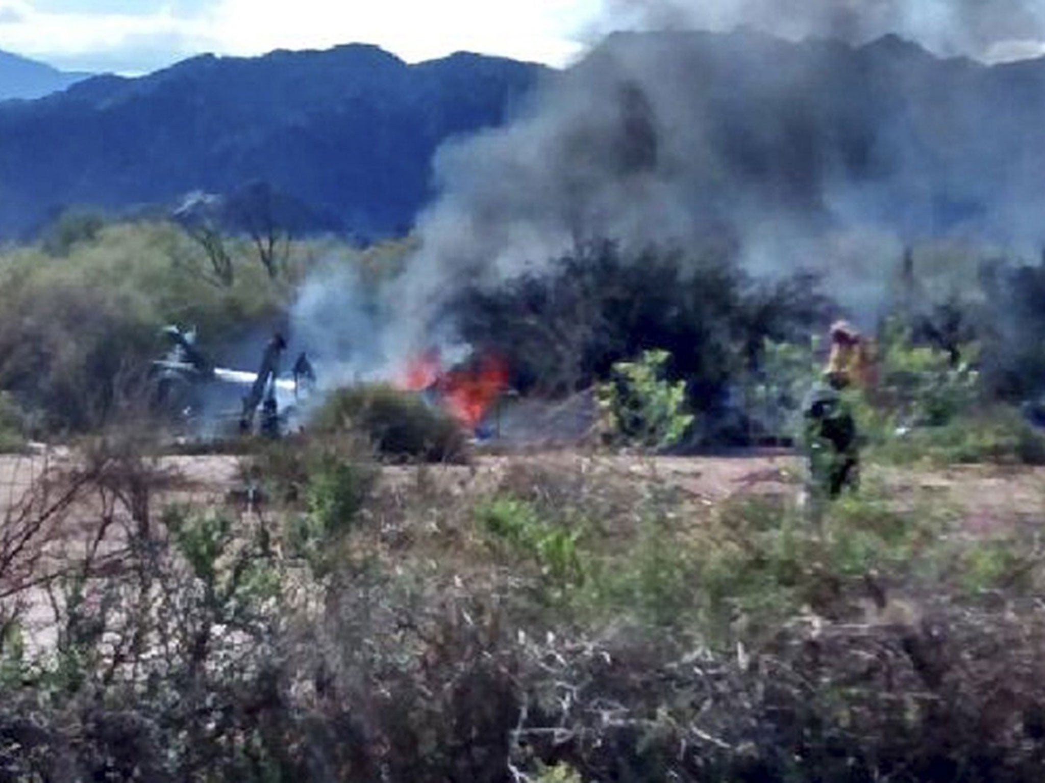 The smoking wreckage of one of the helicopters in Villa Castelli