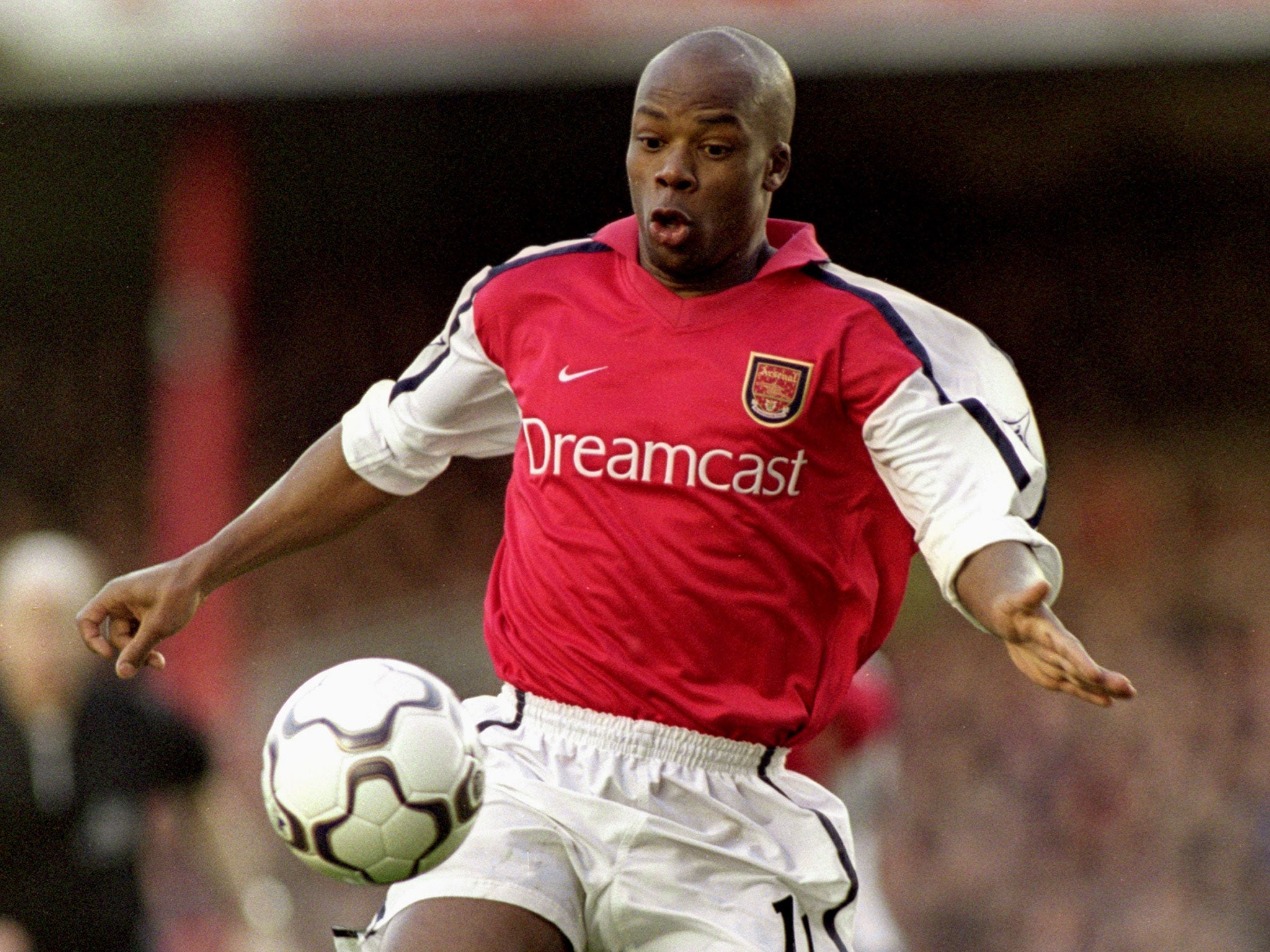 Wiltord in action for Arsenal during his football career