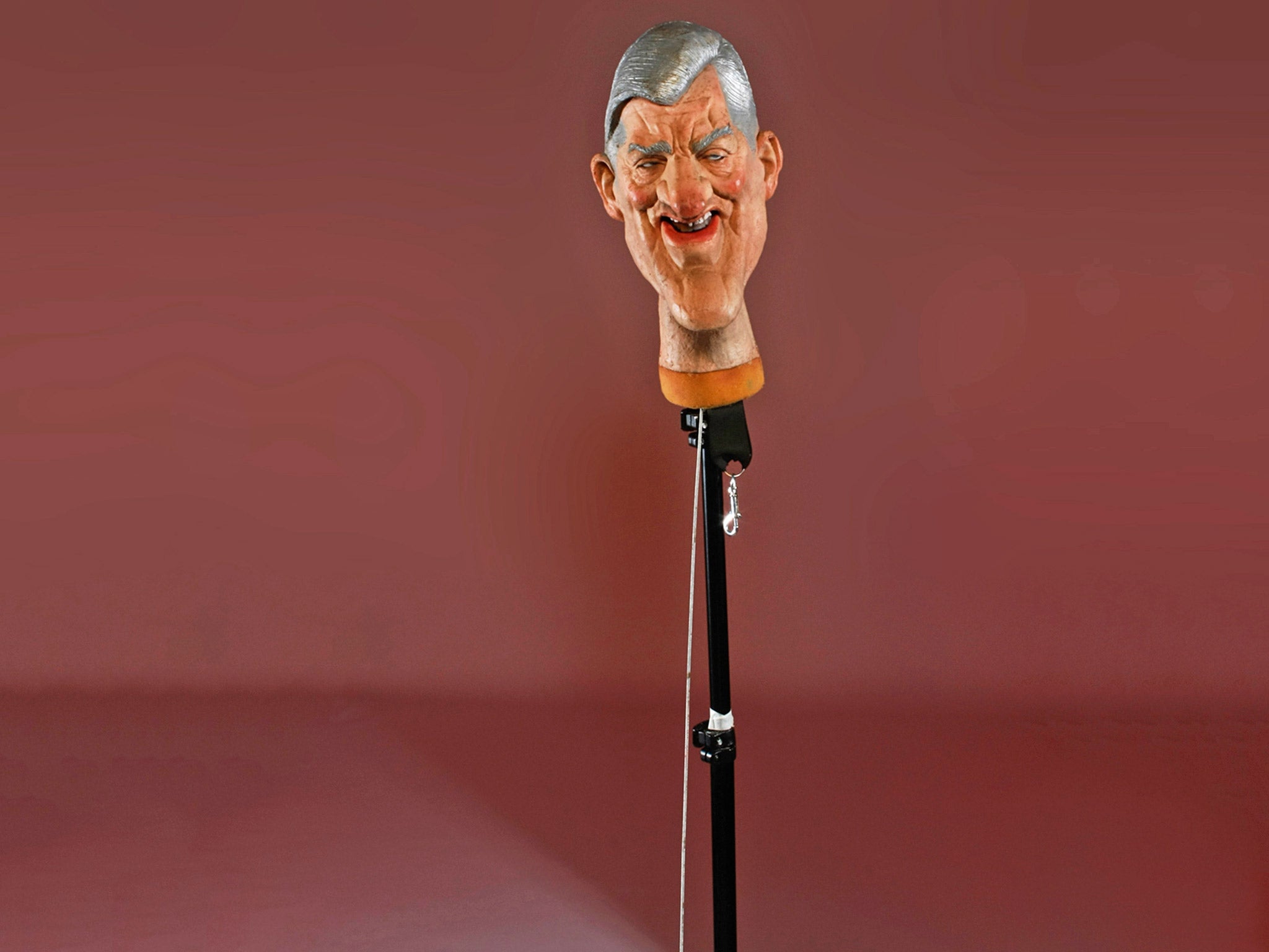 Cecil Parkinson's head is on a monopod set against a burgundy backdrop as if he has been beheaded (Andrew Bruce & Anna Fox)