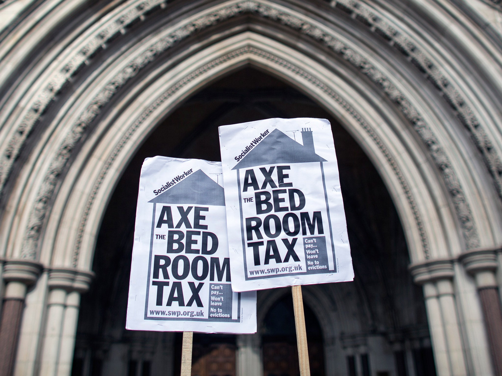 Campaigners demonstrating against the Bedroom Tax outside the Royal Courts of Justice (Getty)