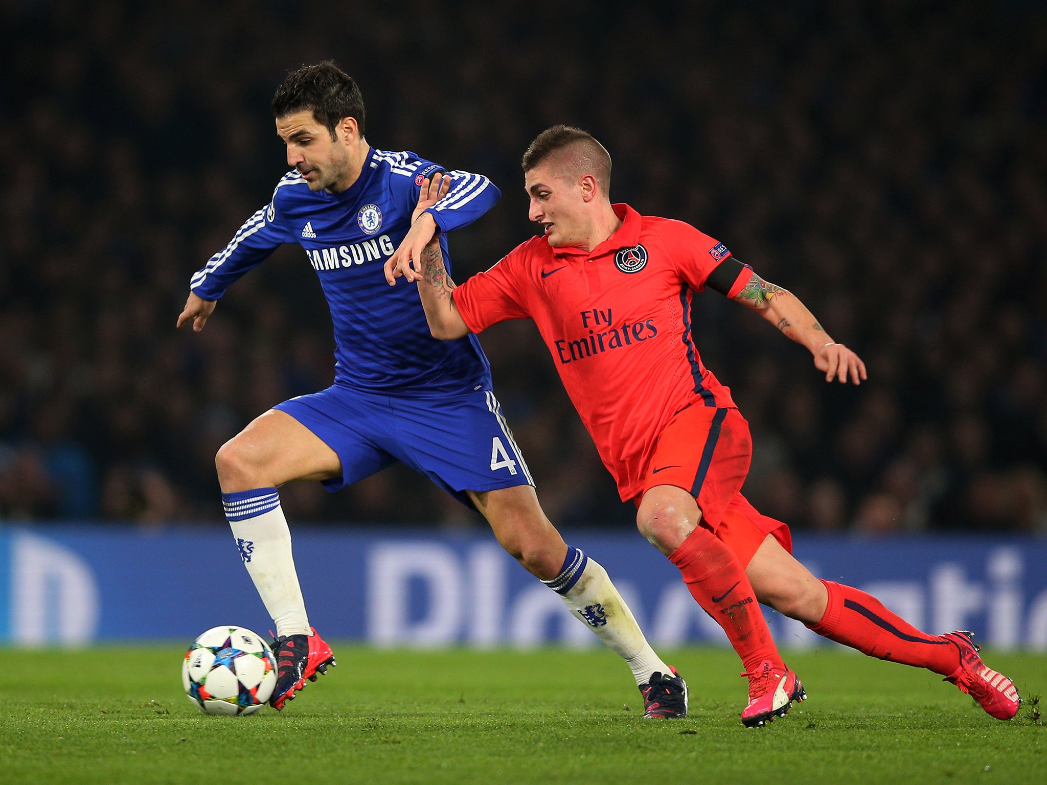 Marco Verratti challenges Cesc Fabregas