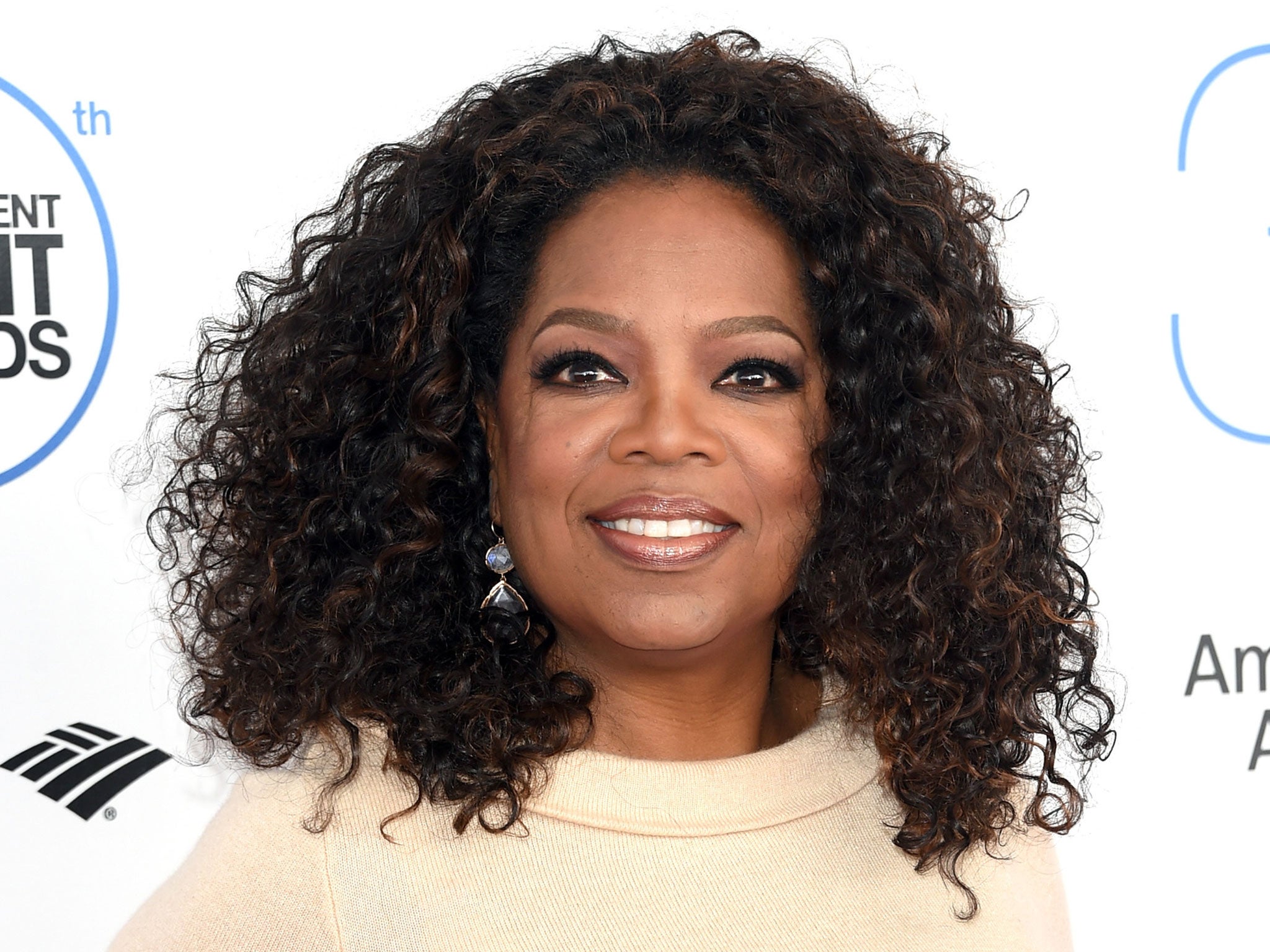 Oprah Winfrey is auctioning off designer pieces from her closet for charity.