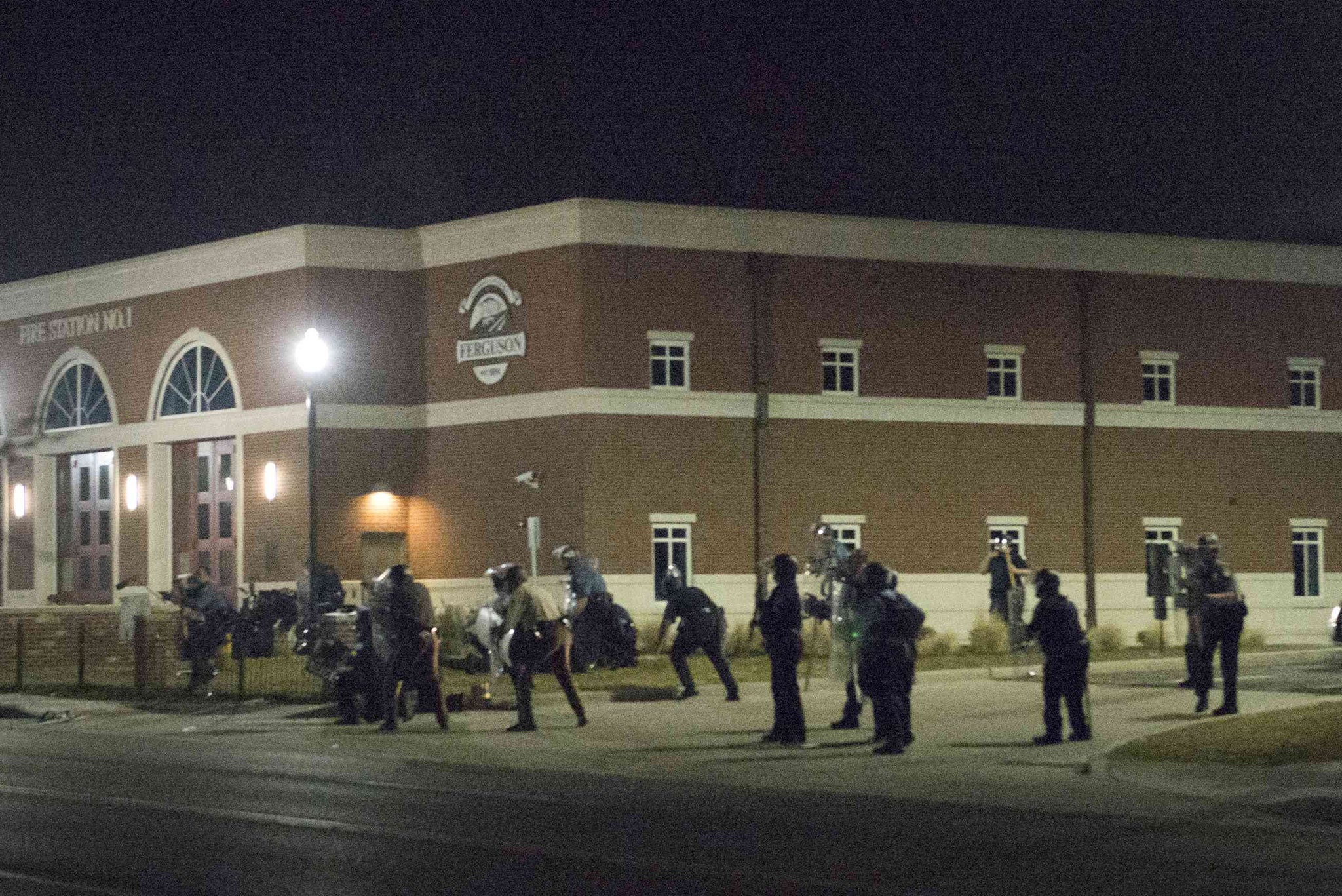 Police react moments after the shots were fired