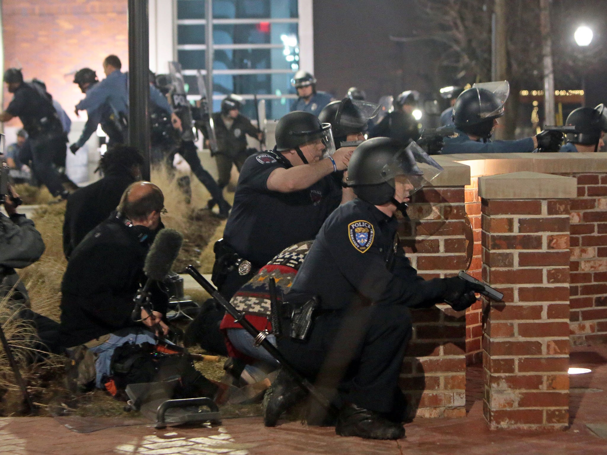 All sections of the community, protesters as loudly as the authorities, have condemned the shootings of two police officers in Ferguson