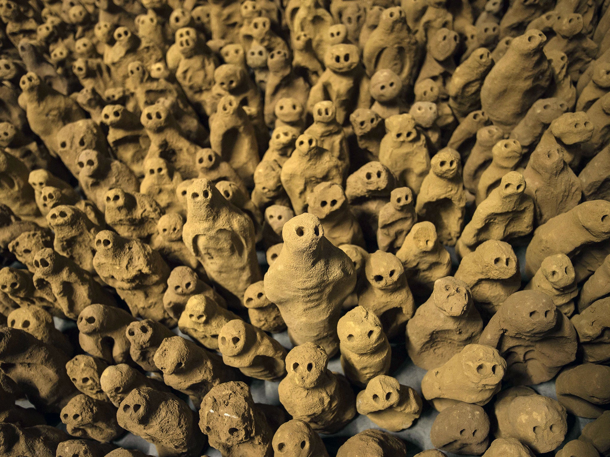 Sculptures that are part of the installation entitled 'Field for the British Isles' by British artist Antony Gormley are laid out in the Nave space of the former St John's Church in Scunthorpe.