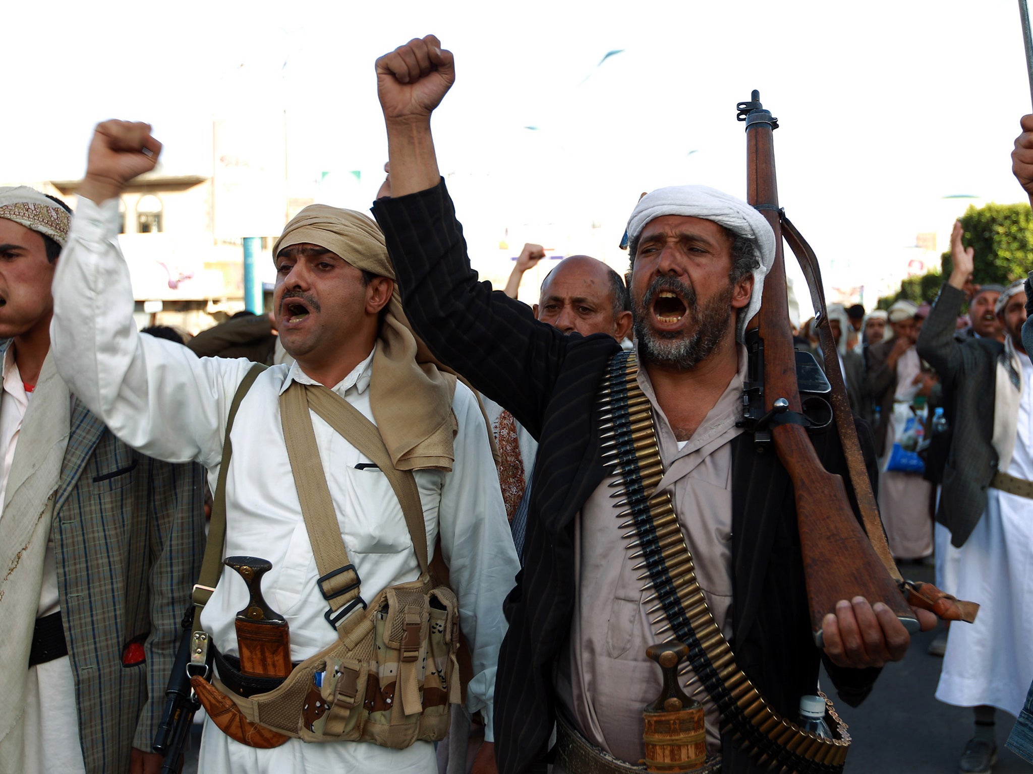 Supporters of the Shiite Houthi movement shout slogans during a rally against US and Saudi intervention in Yemen