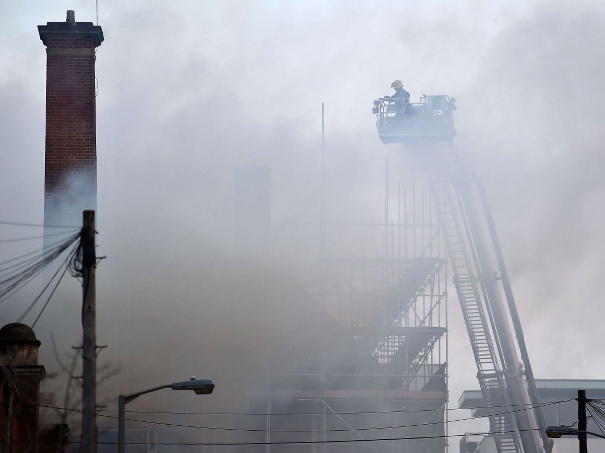 Firefighters tackle a fire at the Battersea Arts Centre in south London on March 13, 2015. Around 80 officers and 12 fire engines were battling the blaze Friday.