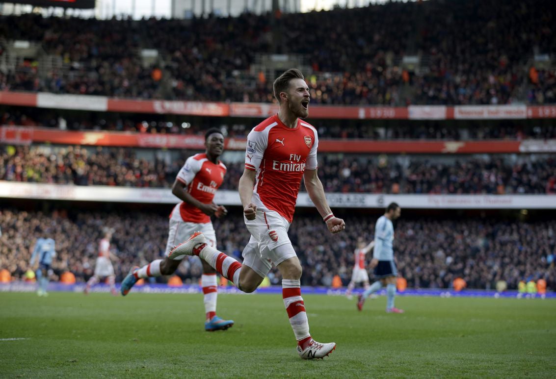 Ramsey celebrates after making sure for Arsenal