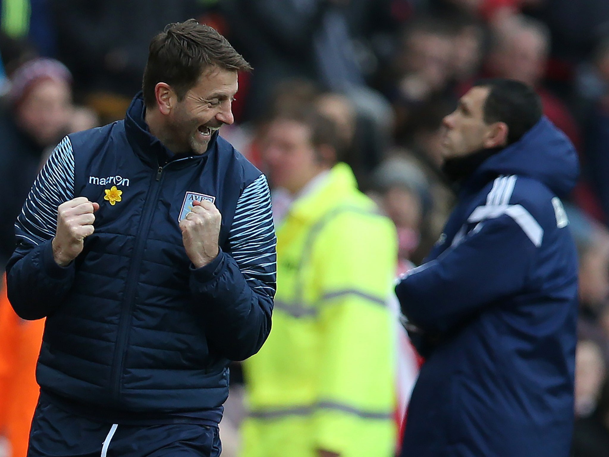 Tim Sherwood celebrates at the Stadium of Light as Gus Poyet looks away