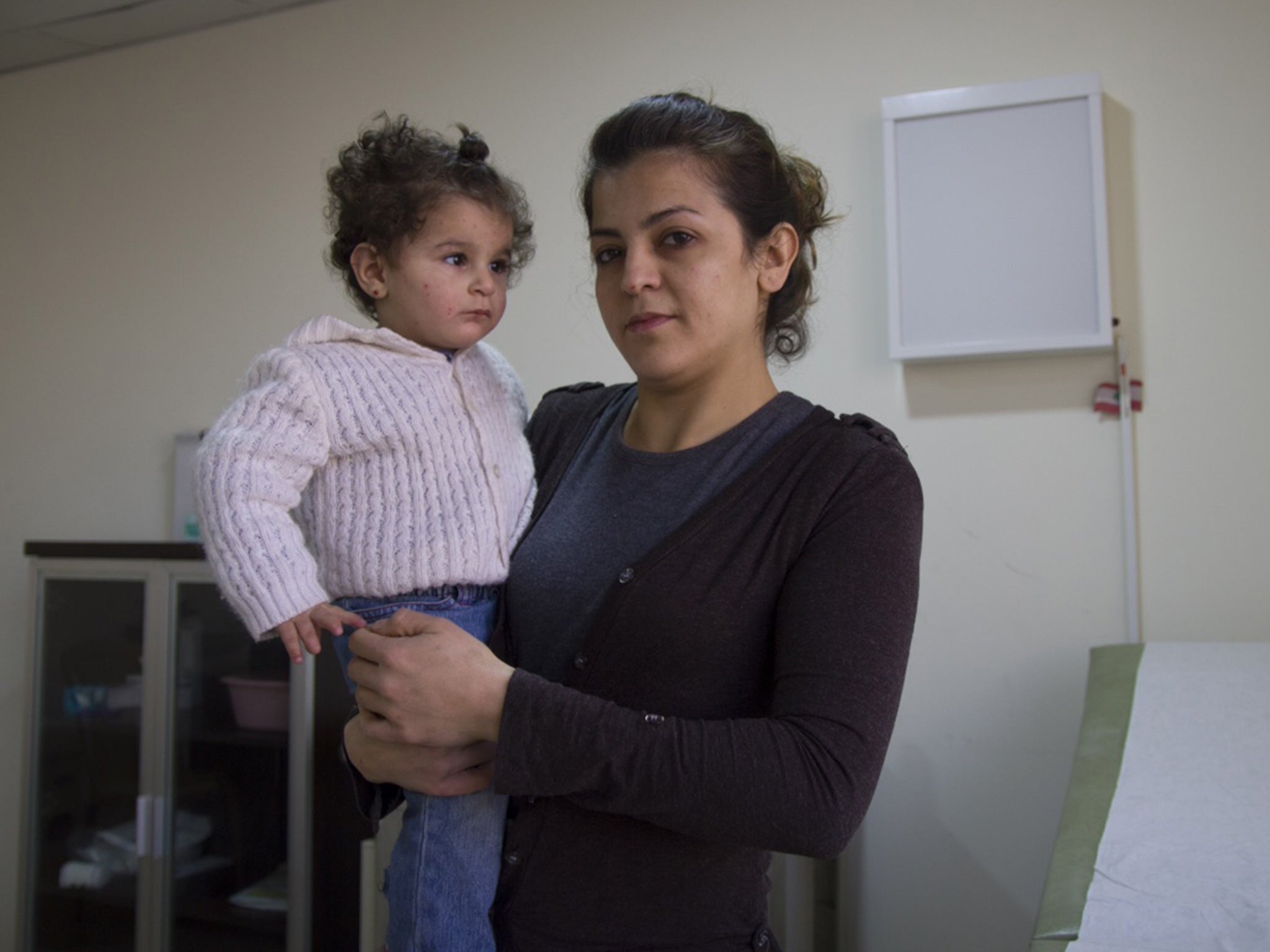 Hanigal Tareq and her daughter Helena in their one-room home