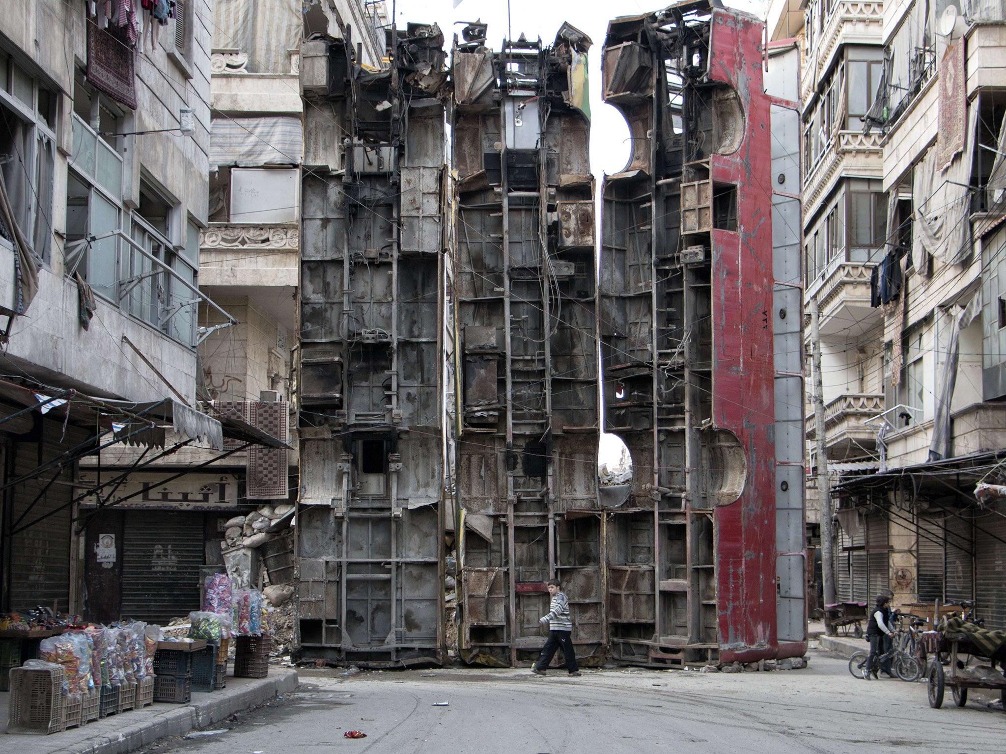 Sandbags are used as barricades in Aleppo's ruins (AFP/Getty)