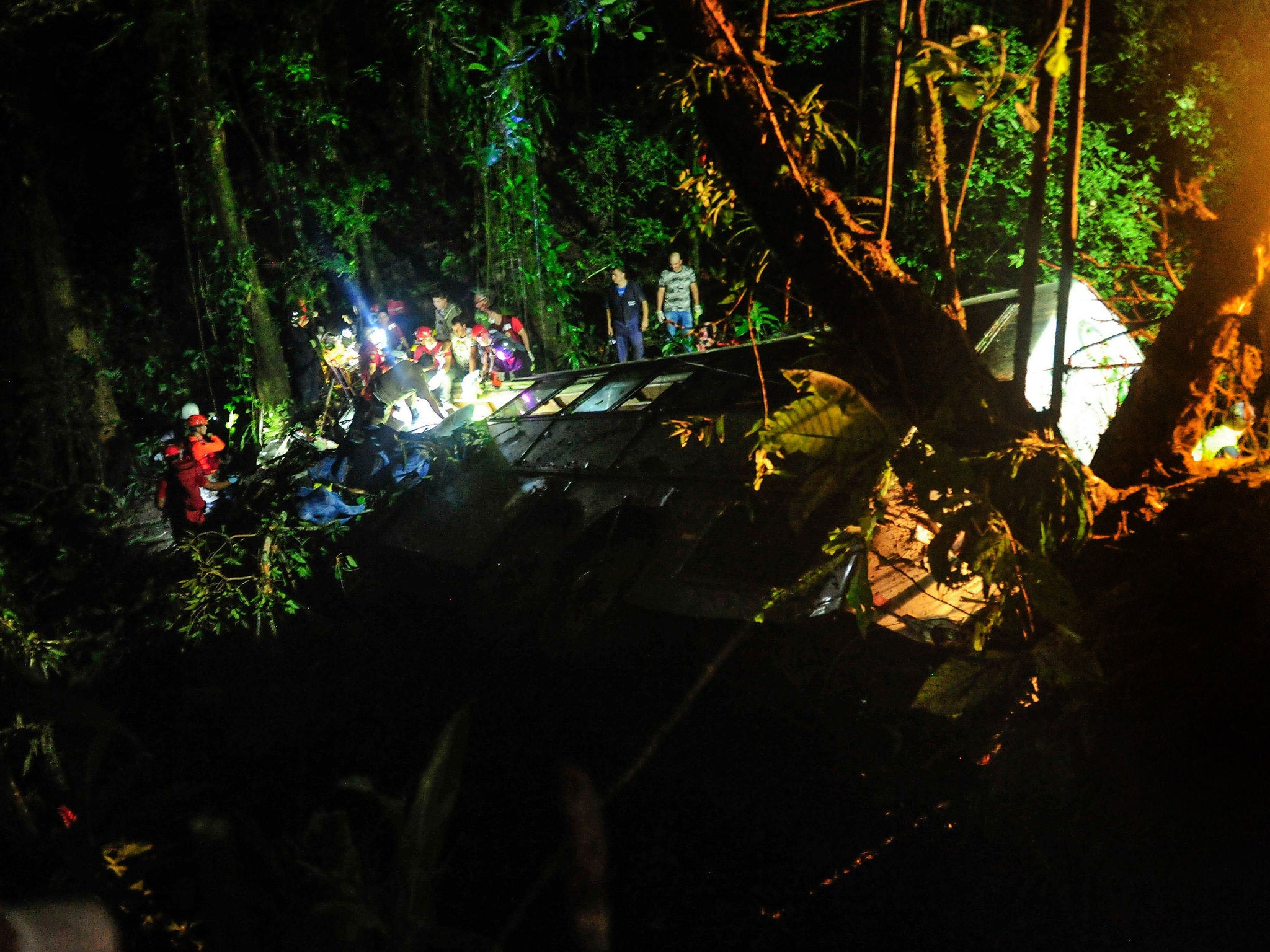 Firefighters working at the scene of a bus accident in Campo Alegre, state of Santa Catarina, southern Brazil