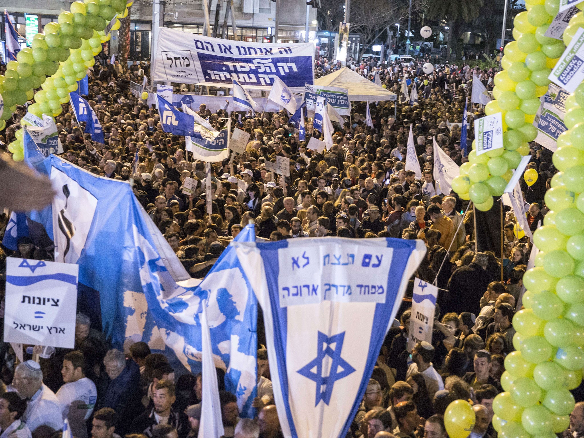 Likud supporters gather in Tel Aviv to hear Benjamin Netanyahu speak, as the Prime Minister makes a last-ditch effort to garner support from other right-wing parties