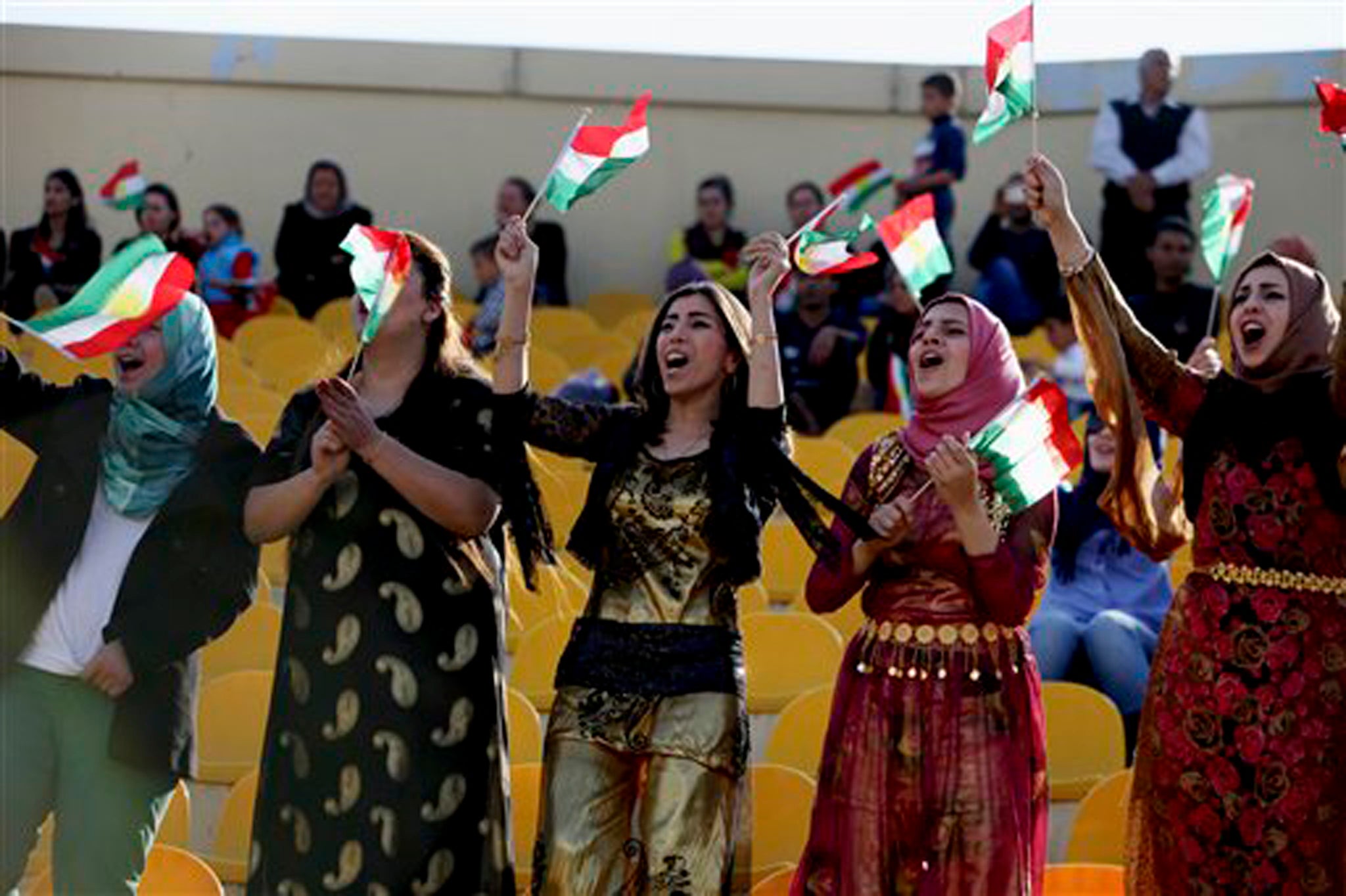 Kurdish women in the audience watch US rappers Nelly and Ali perform