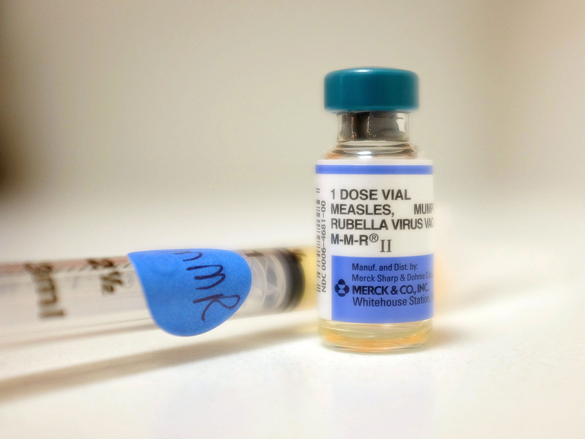 A bottle of measles vaccination