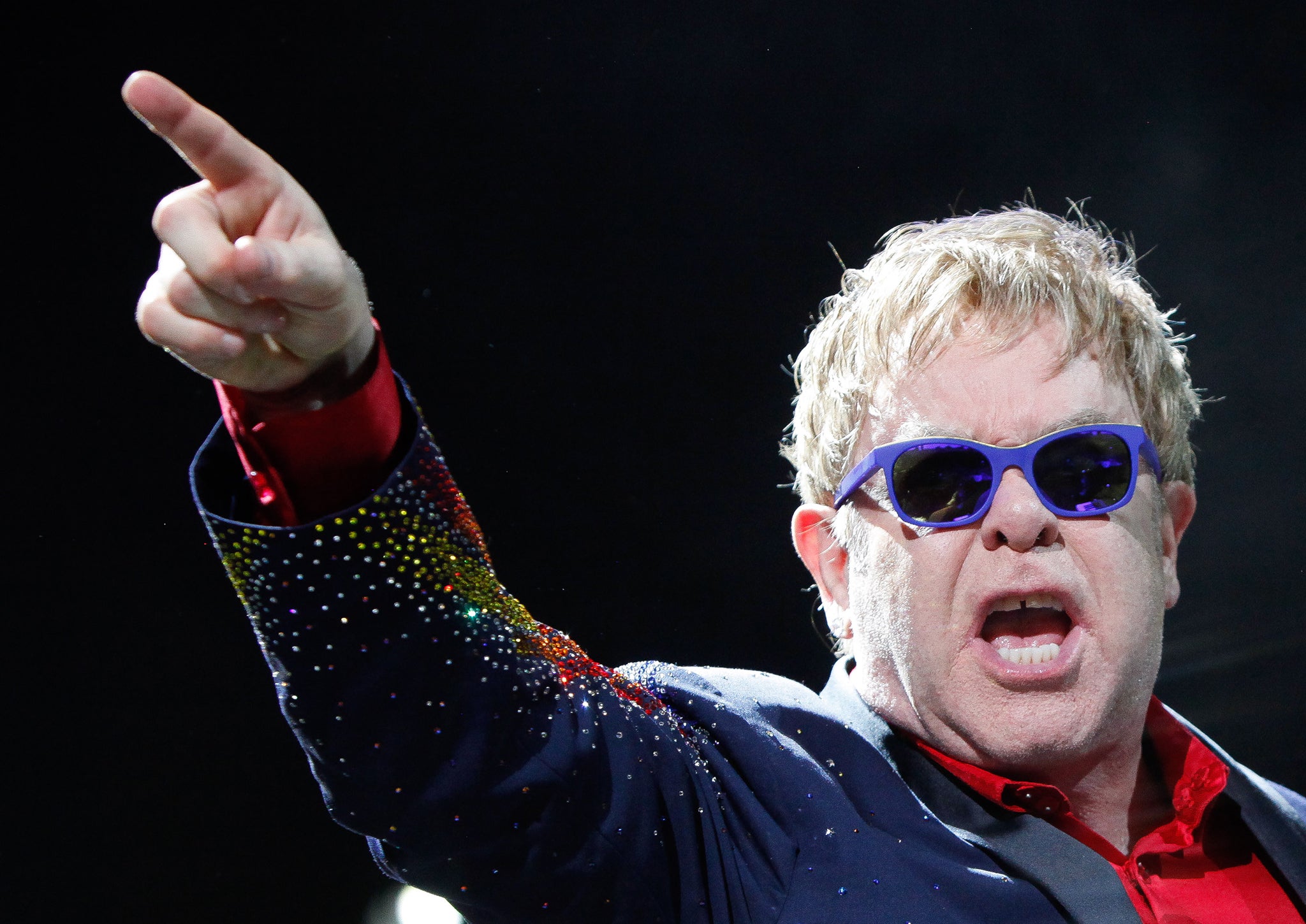 Elton John does his best Ray Winstone impression during a concert last year