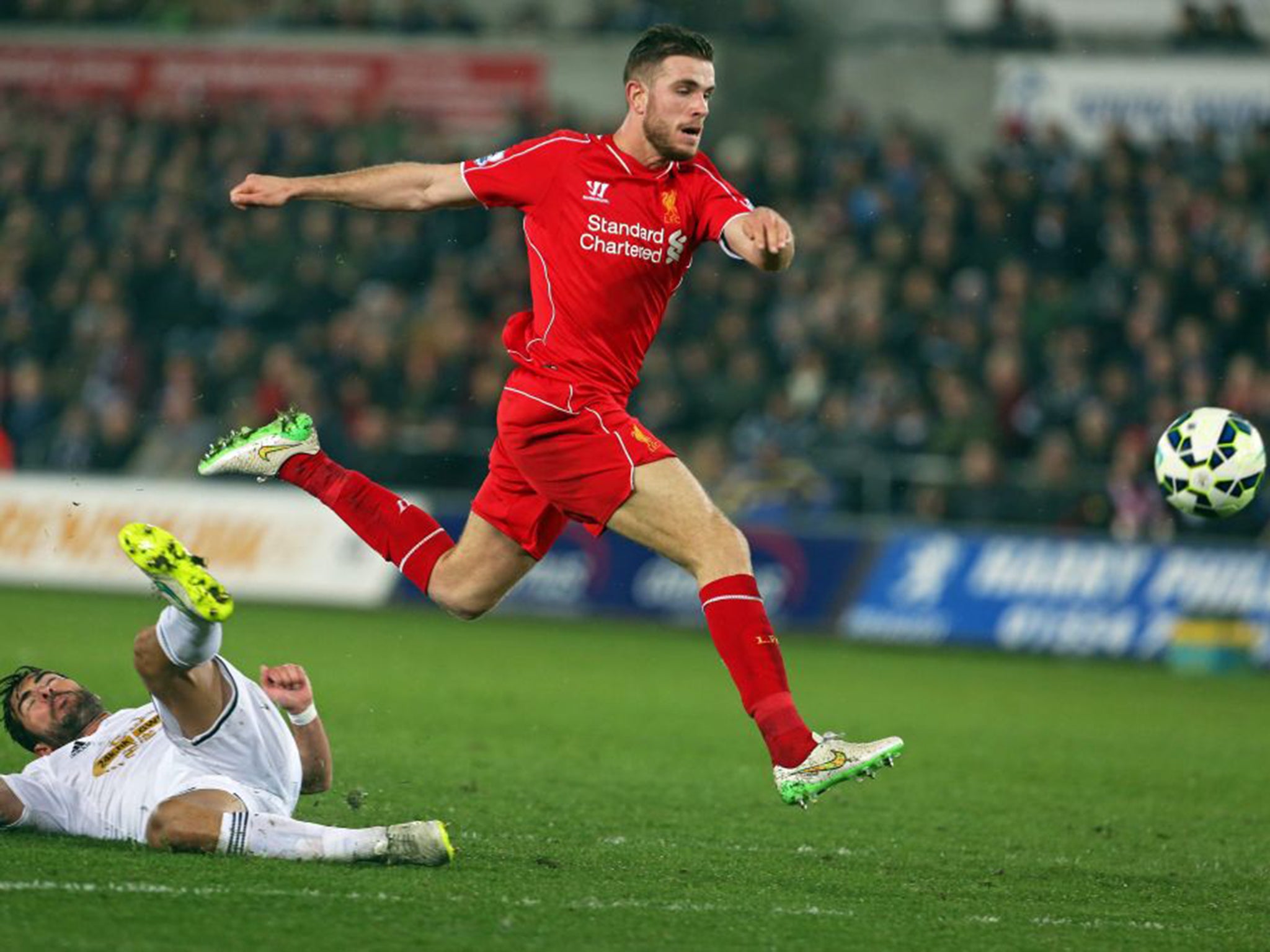 Jordan Henderson scores Liverpool’s goal after Jordi Amat’s sliding tackle only pushed the ball on to the midfielder’s shin