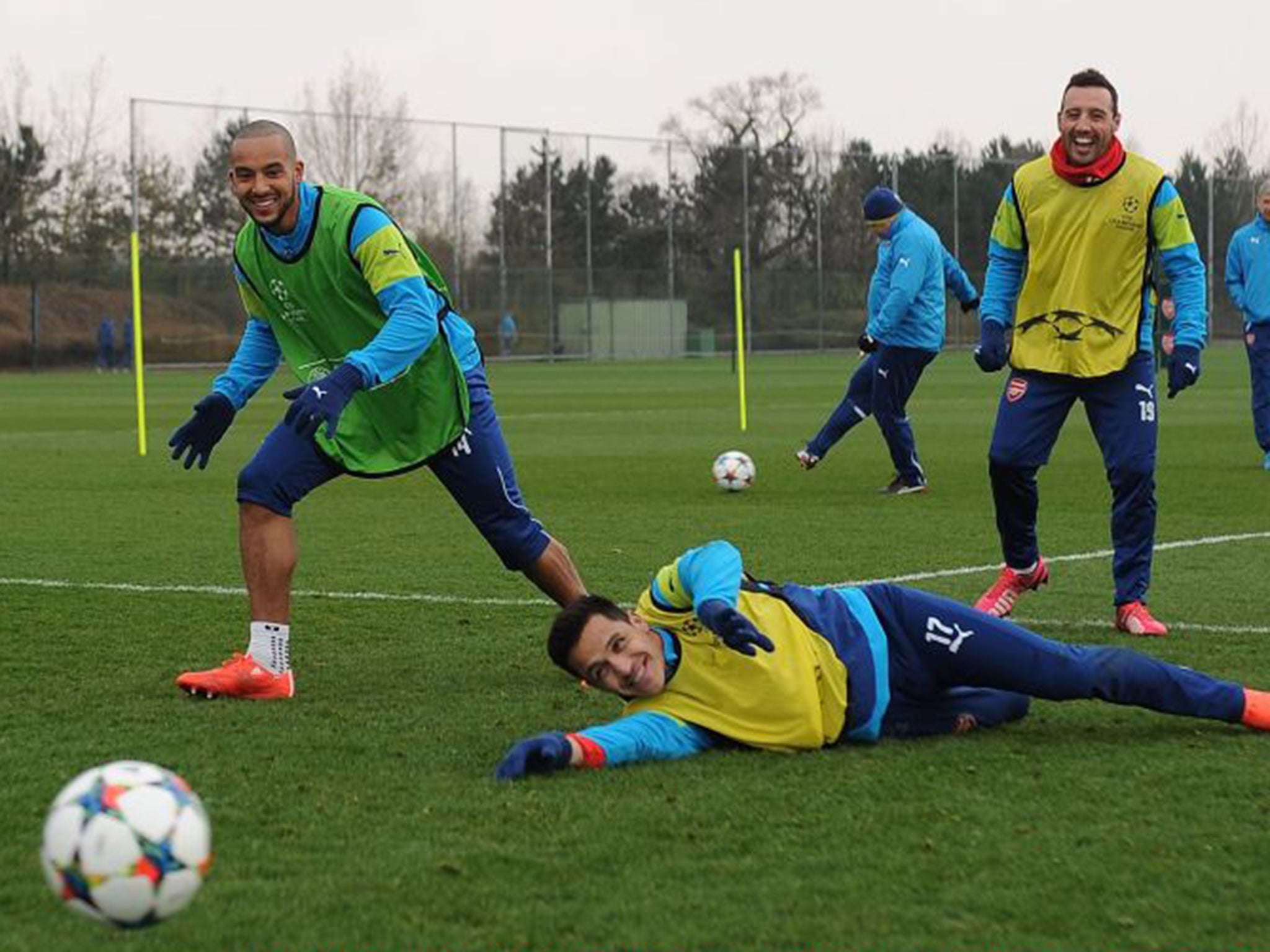 Left to right: Theo Walcott, Alexis Sanchez and Santi Cazorla during Arsenal’s training session at London Colney on Monday