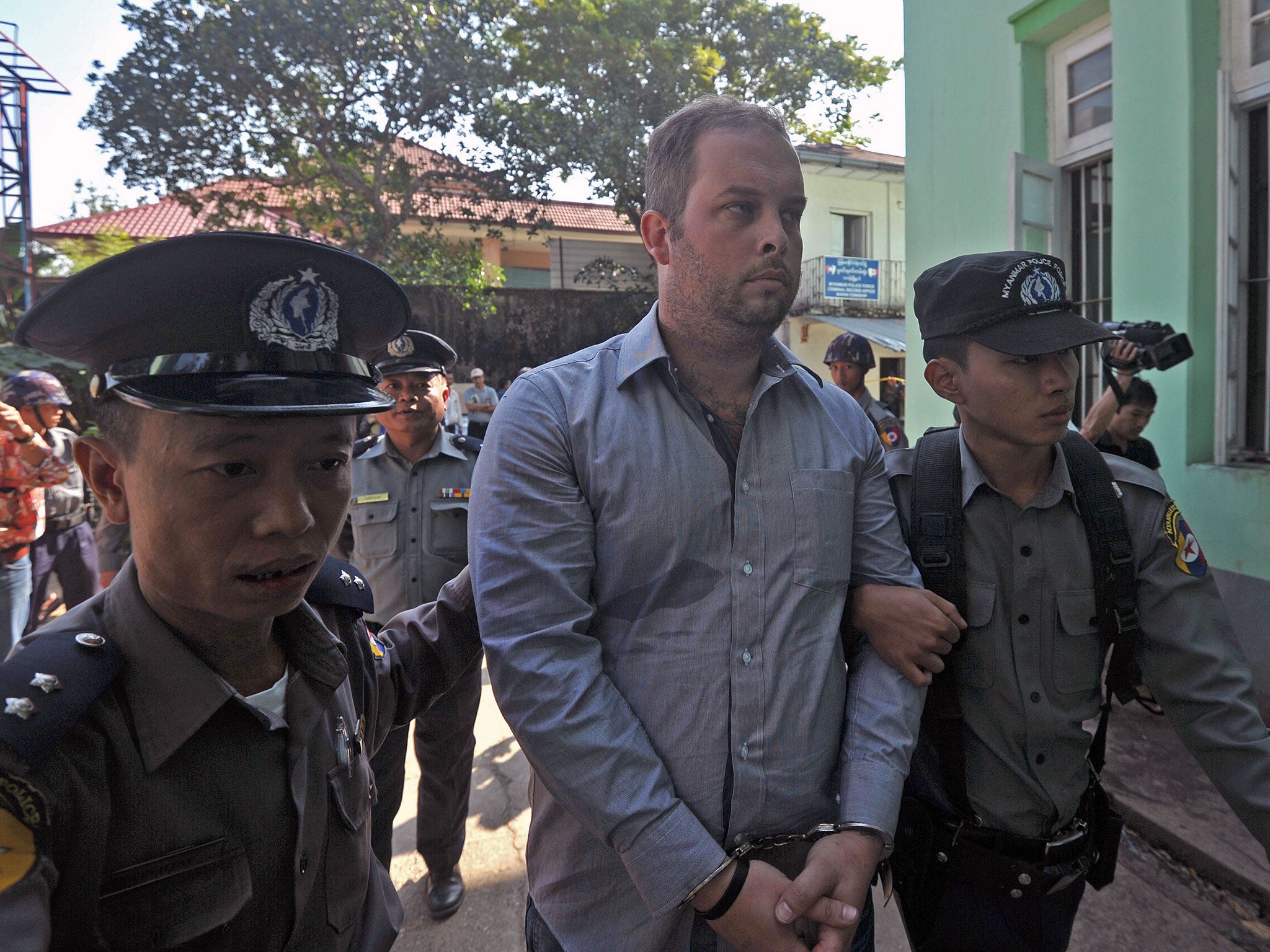 Philip Blackwood (C), pictured during his arrest in December.