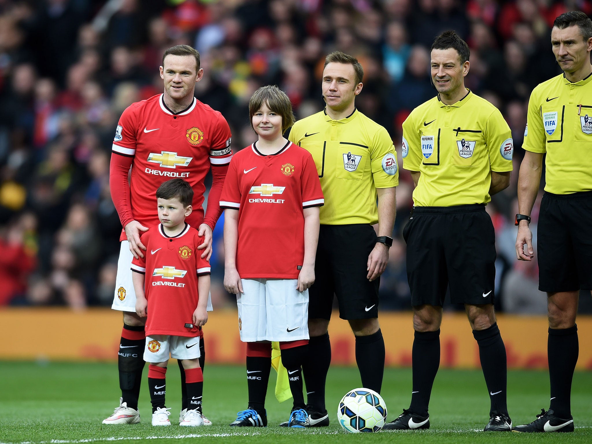 Rooney poses with his son Kai ahead of the game against Spurs