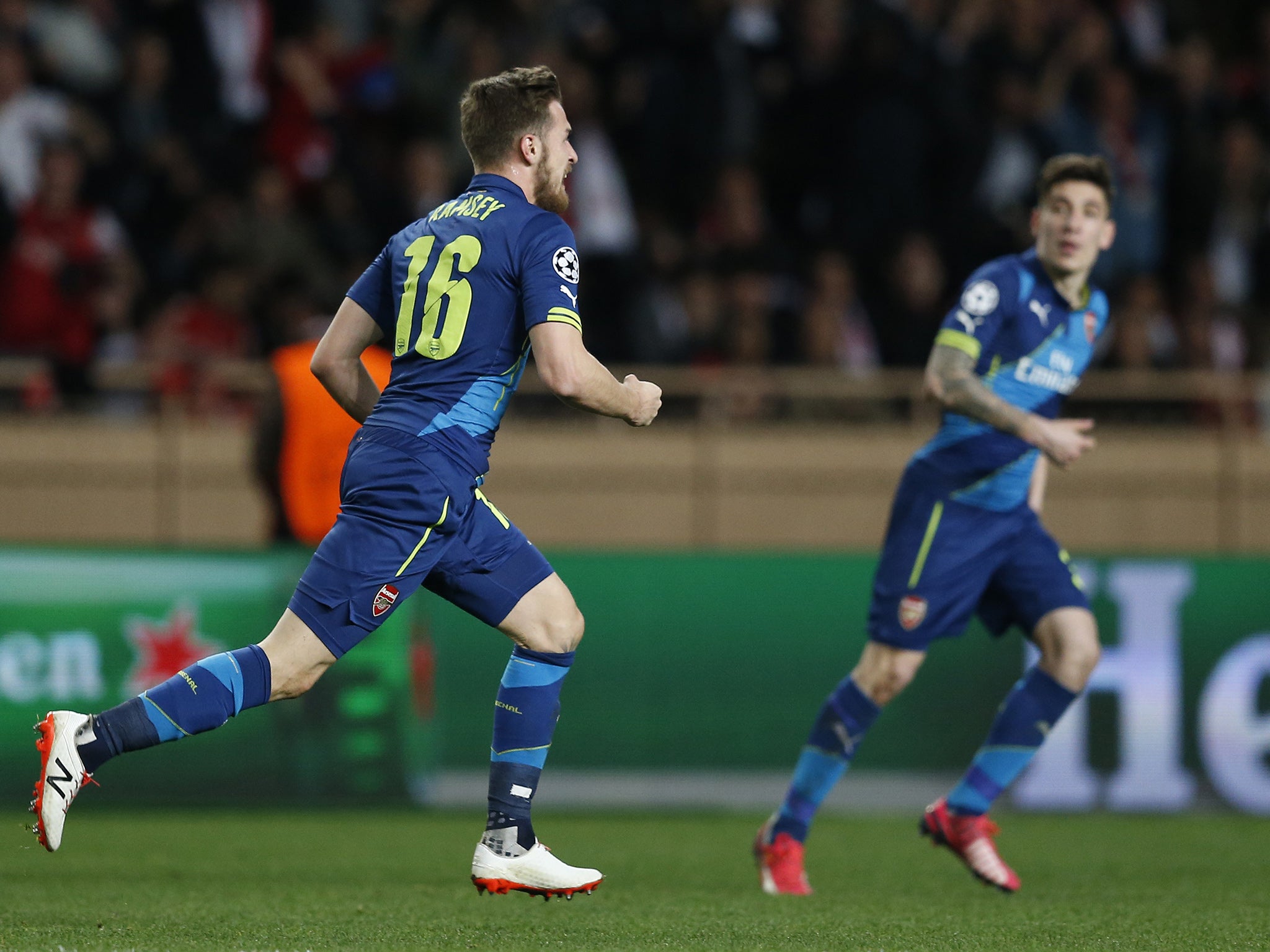 Aaron Ramsey (left) wheels away in celebration after late goal