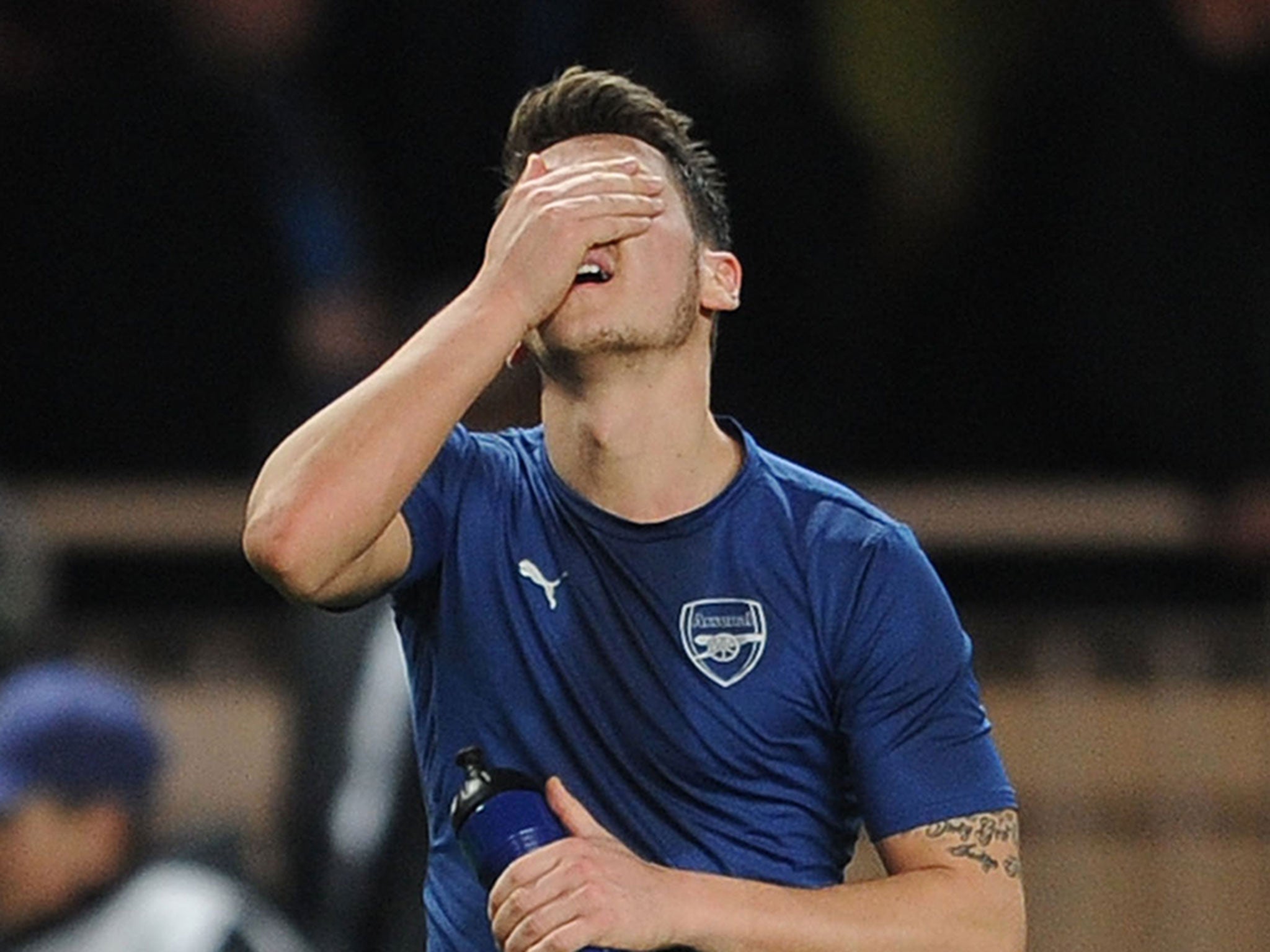 Ozil reacts after Arsenal were knocked out on Tuesday