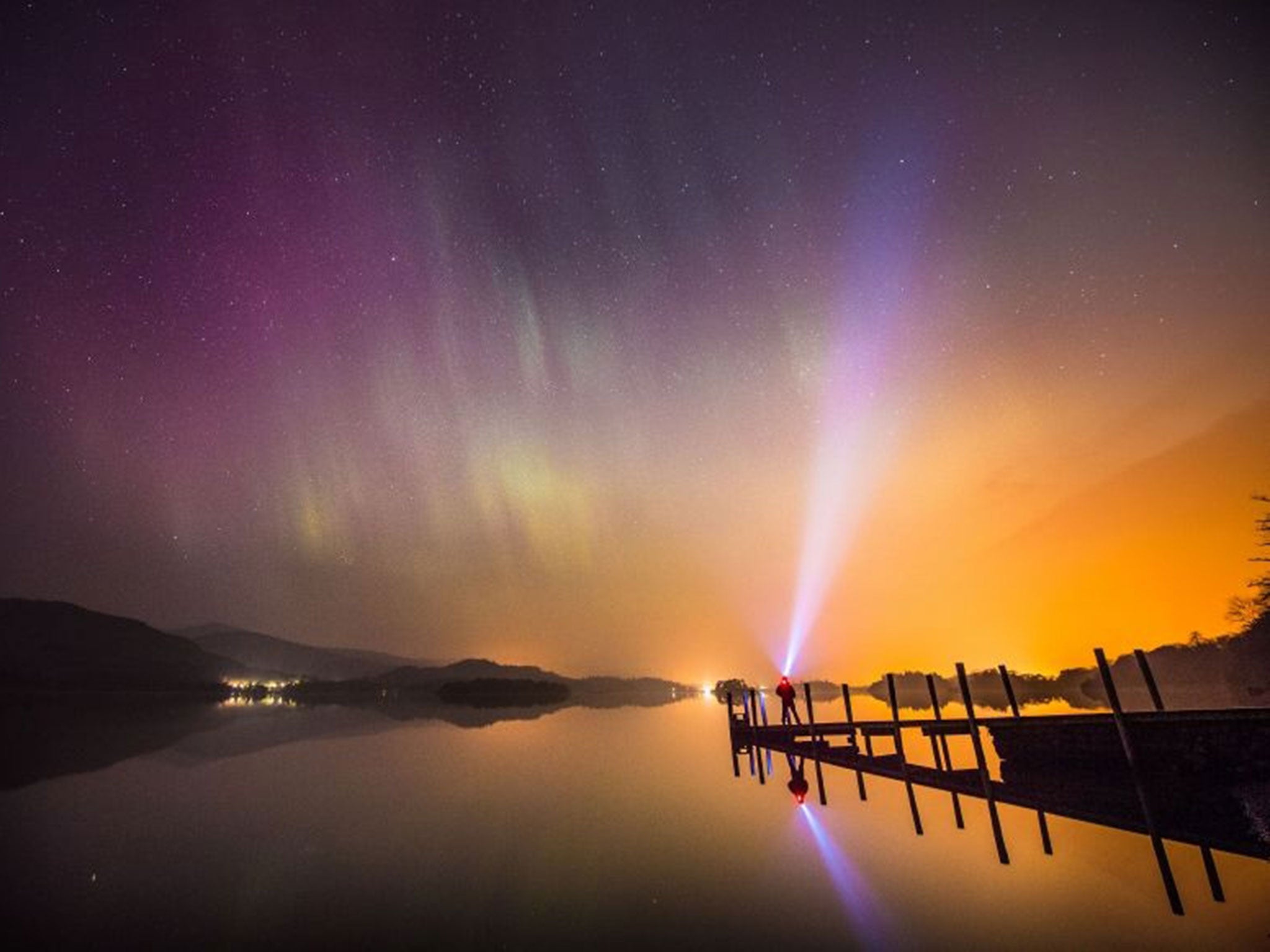 The aurora borealis, or the northern lights as they are commonly known, over Derwent water near Keswick in the Lake District.