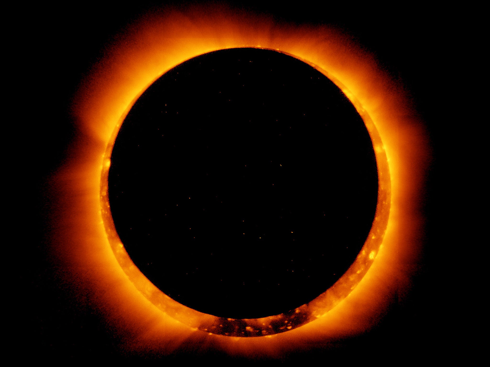 Sun spots are seen as the moon moves into a full eclipse position