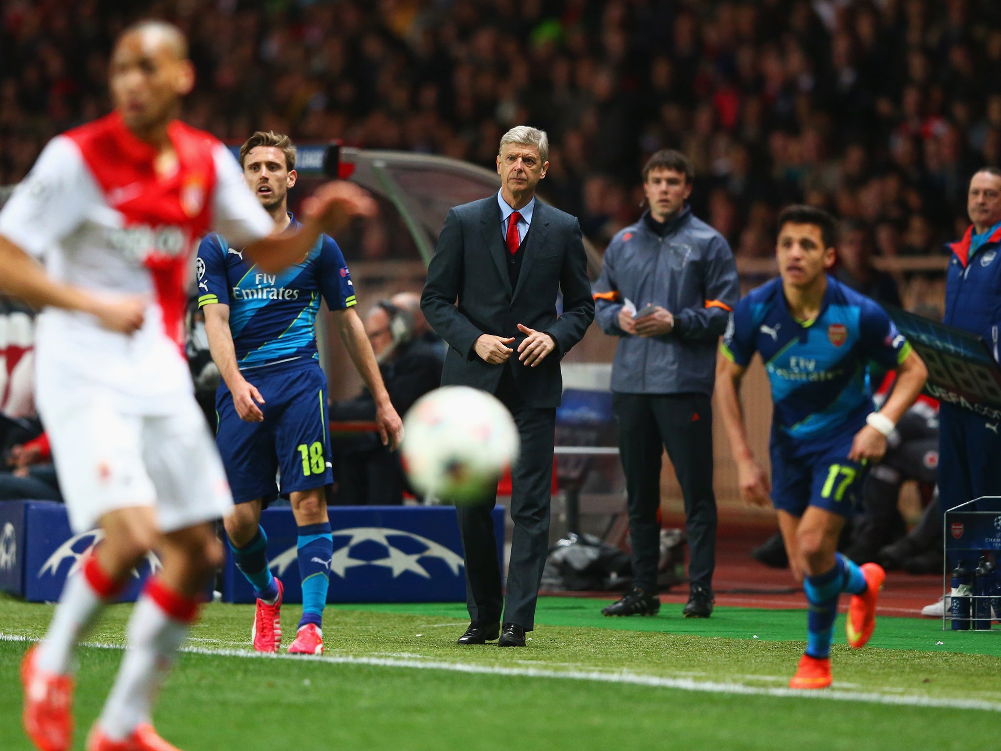 Arsene Wenger watches Arsenal's elimination from the Champions League