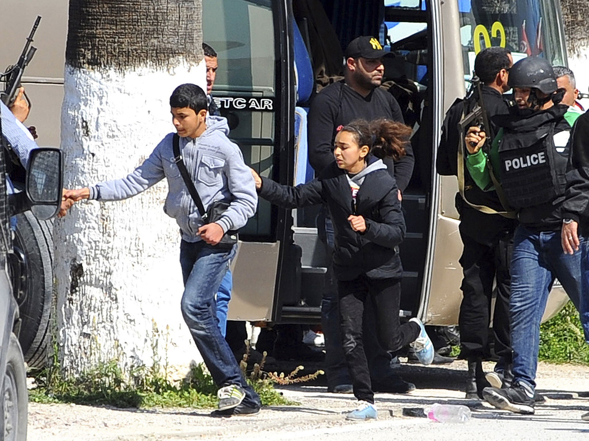 Tourists and visitors from the Bardo museum are evacuated in Tunis. Gunmen opened fire at a leading museum in Tunisia's capital, killing 19 people including 17 tourists. A later raid by security forces left two gunmen and one security officer dead but end