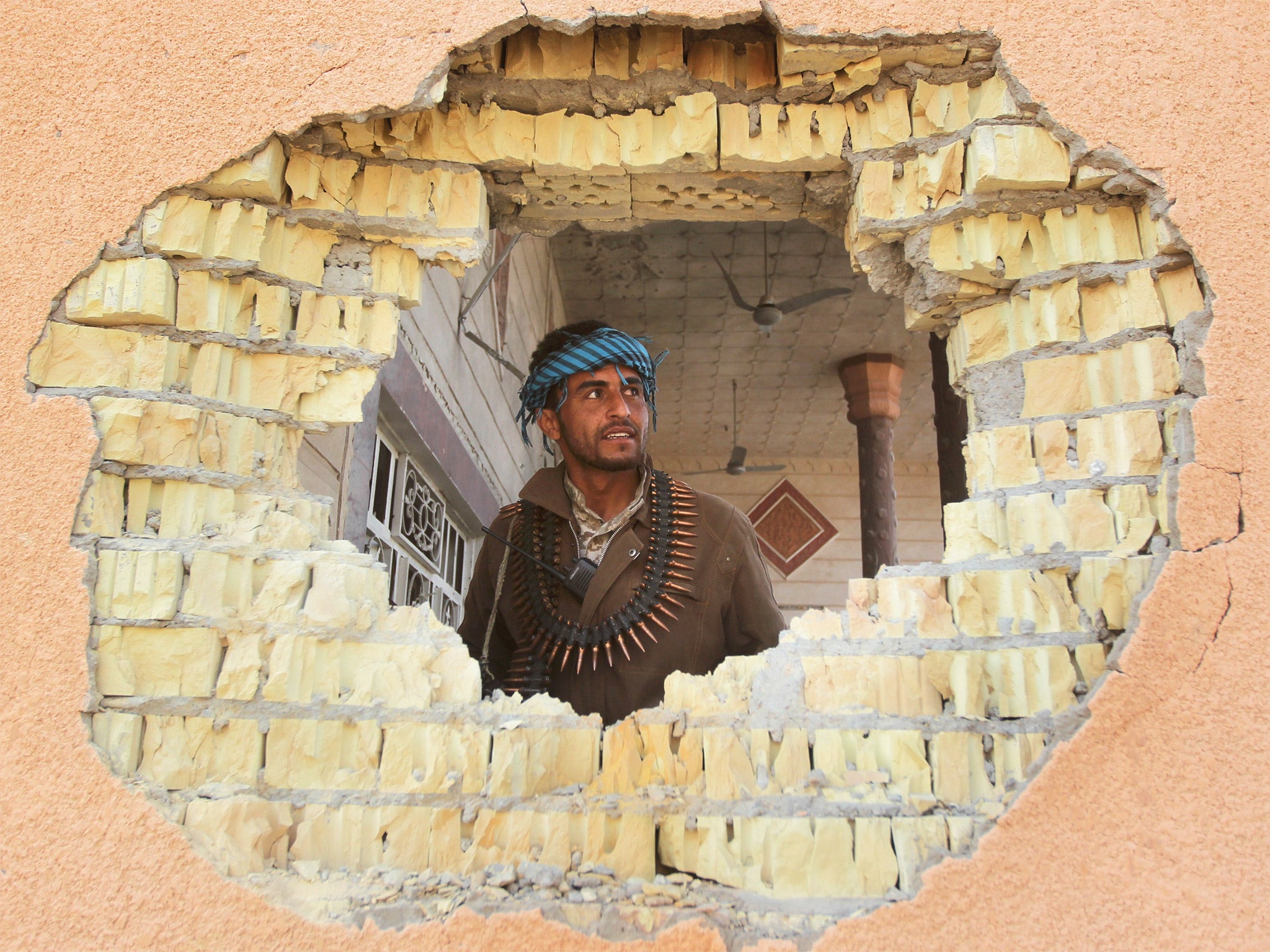 An Iraqi Sunni fighter in the aftermath of a battle with Isis in the village of Sharween, north-east of Baghdad