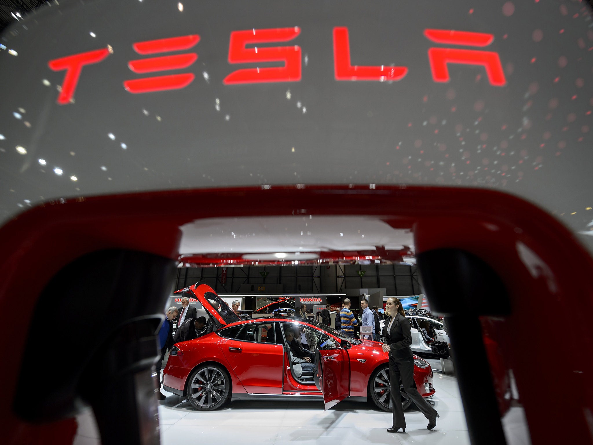 Apple is reportedly eying up electric car manufacturer Tesla (Getty)