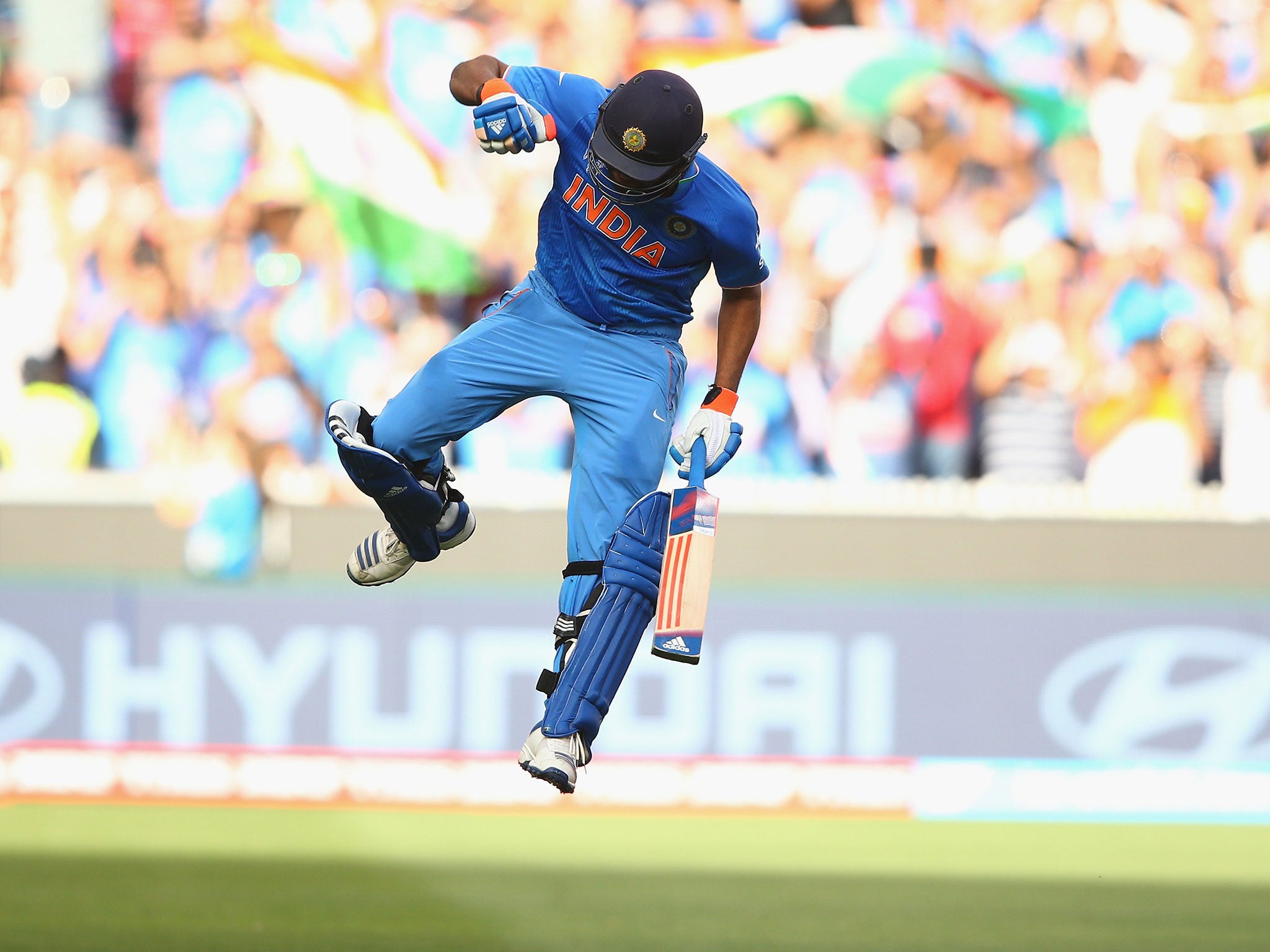 Rohit Sharma celebrates reaching his century against Bangladesh