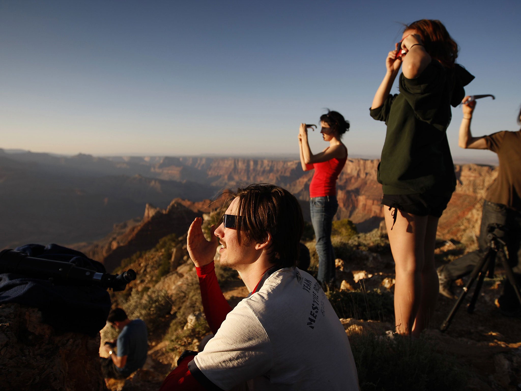 Tourists watch the eclipse over the Grand Canyon in 2012