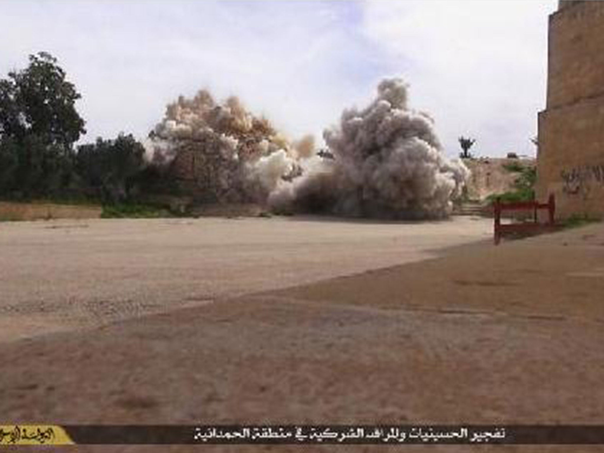 Another part of the monastery is shown surrounded by plumes of smoke