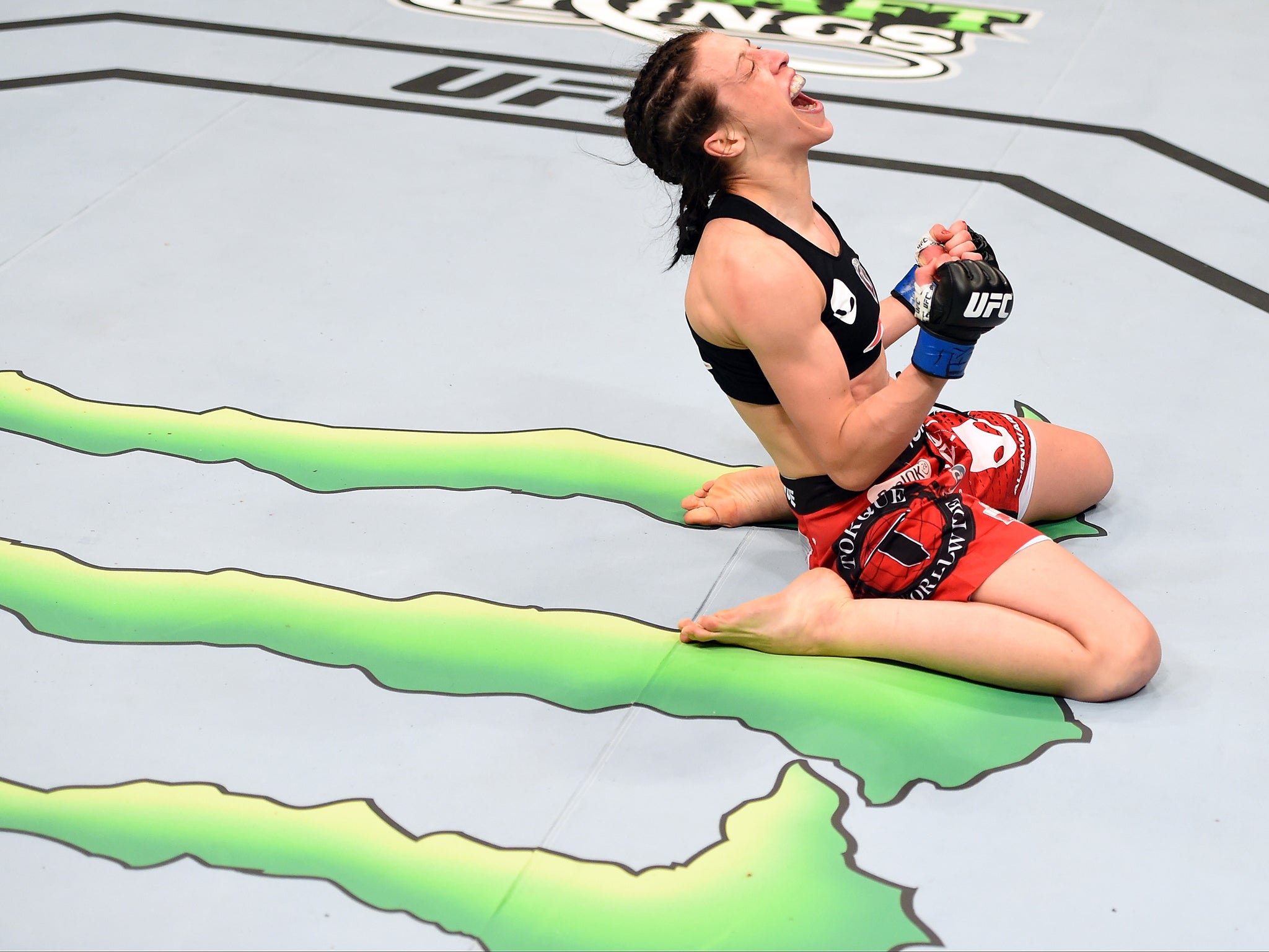 Joanna Jedrzejczyk celebrates after defeating Carla Esparza (Josh Hedges / Zuffa LLC)