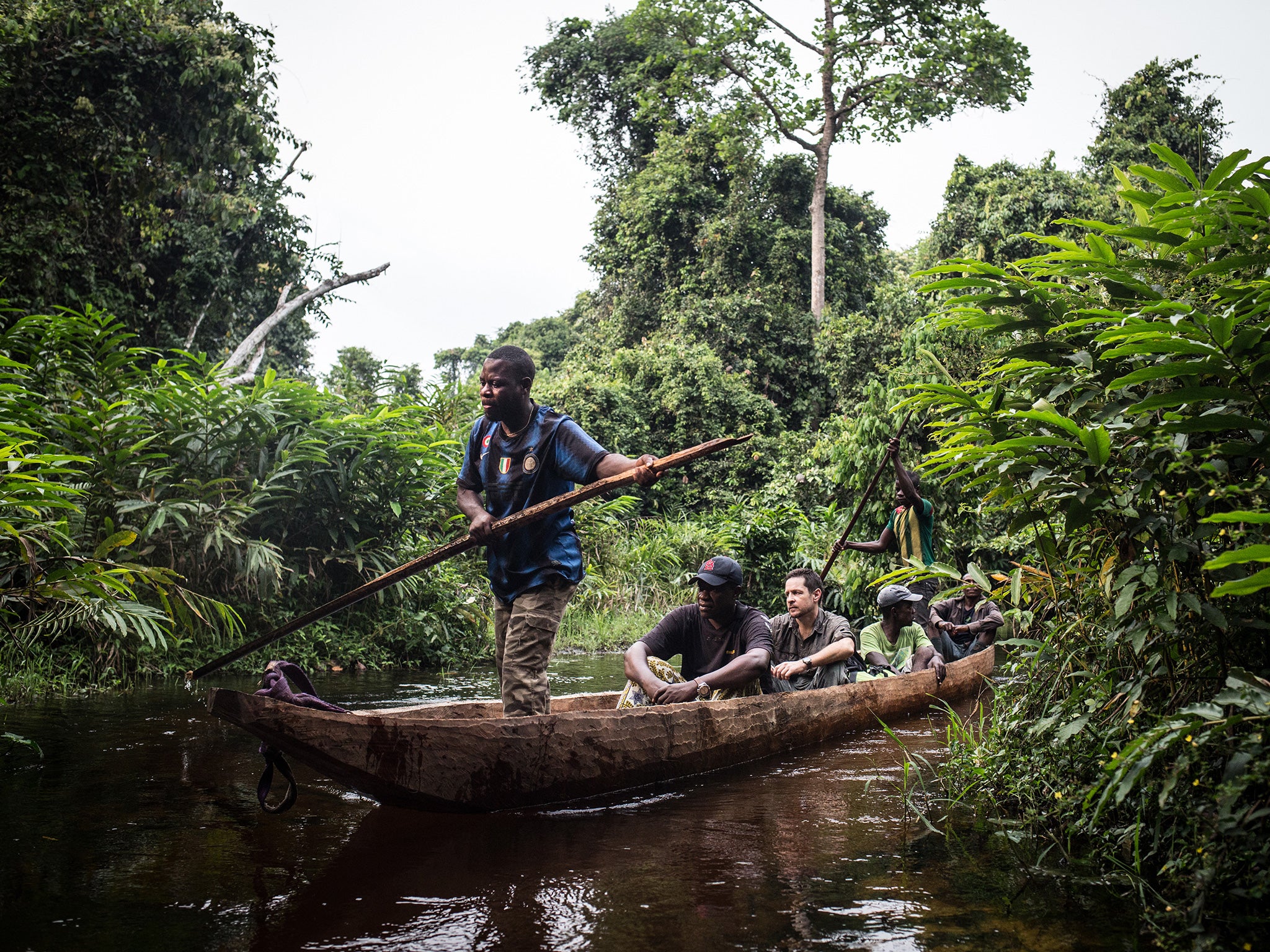 The field team canoes through the National Park