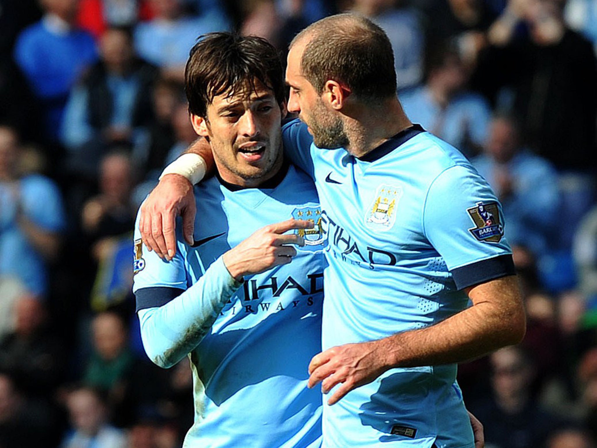 David Silva celebrates the third goal with Pablo Zabaleta