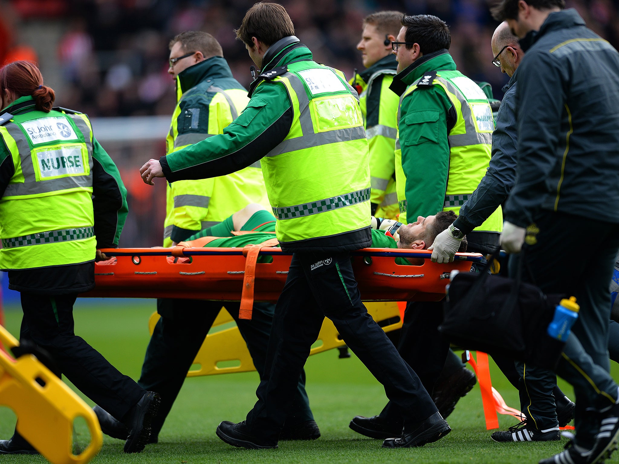 England No 2 Fraser Forster was carried off on a stretcher after a heavy fall