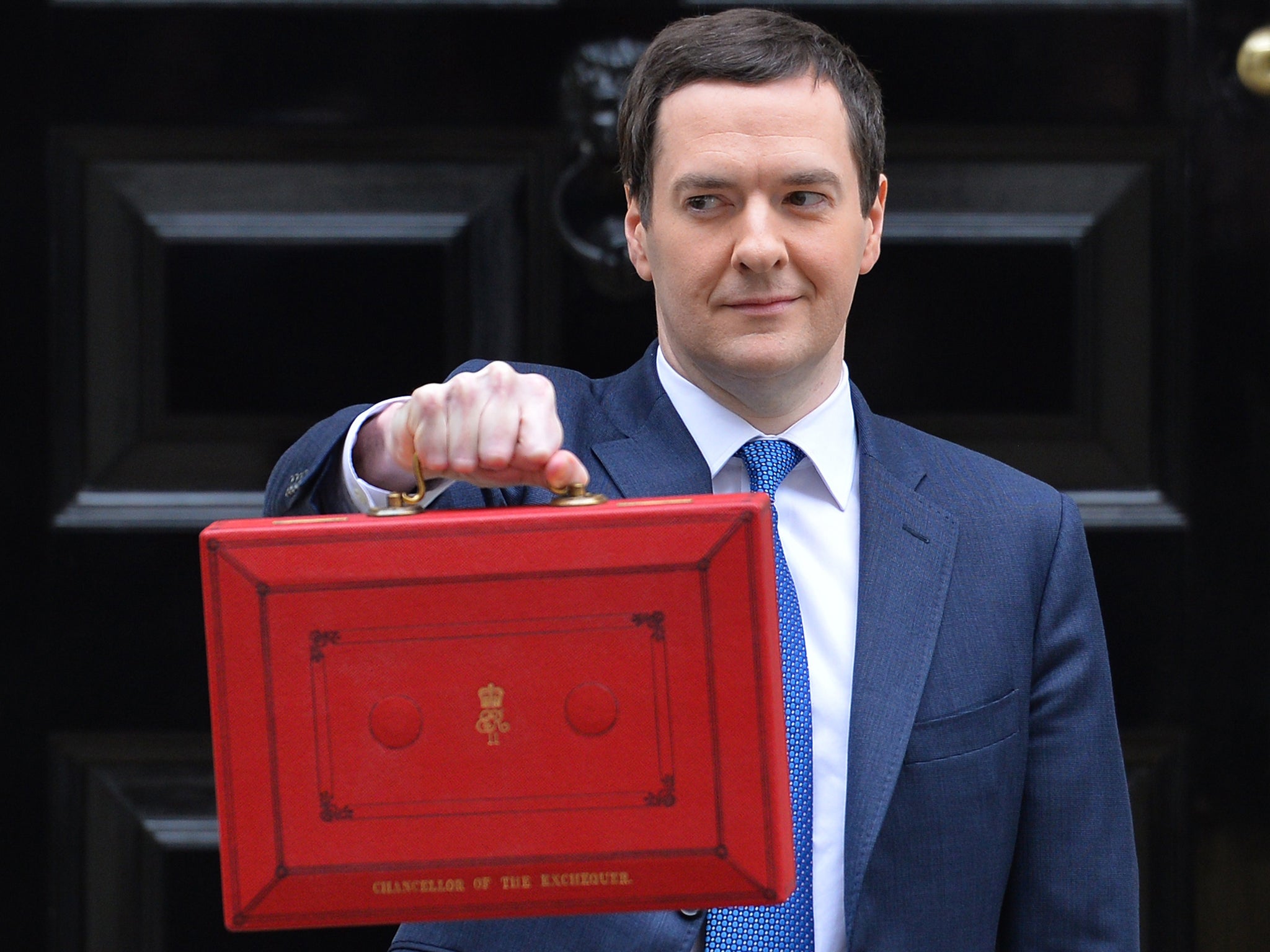 Britain's Chancellor George Osborne stands outside his official residence at 11 Downing Street in London, prior to unveiling the budget