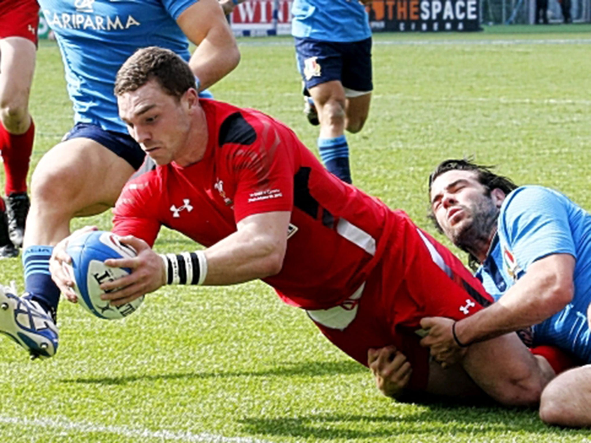 George North scores the second of his three tries for Wales against Italy on Saturday