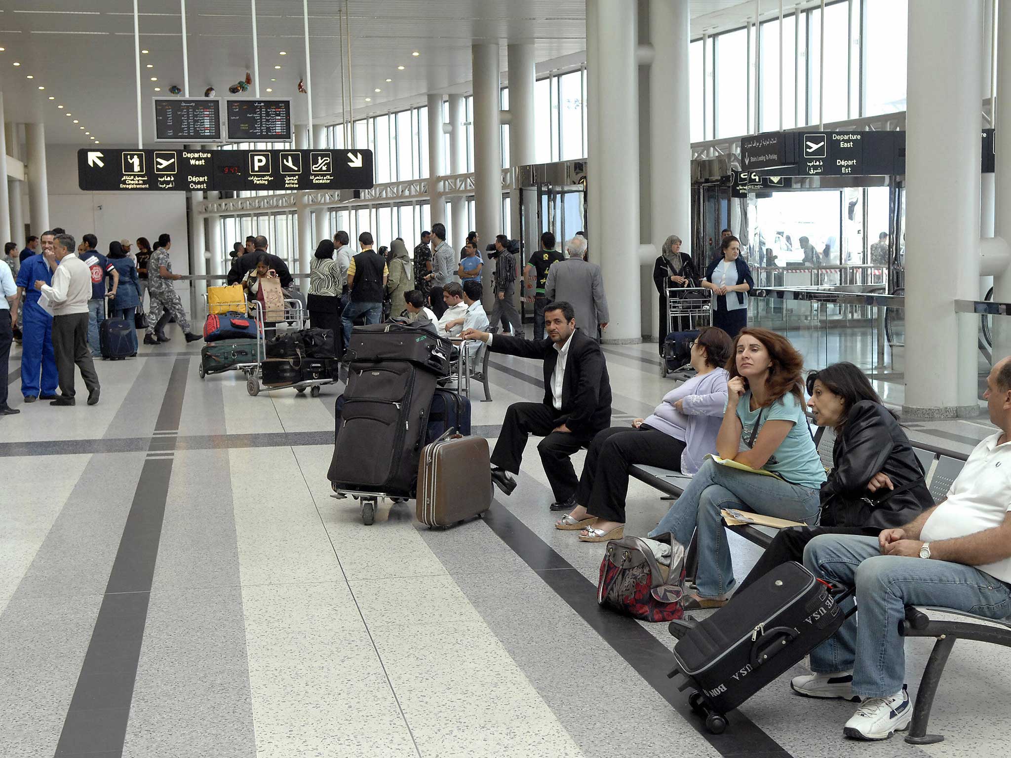 Passengers wait in one of the terminals of Rafik Hariri International Airport where custom officials recently confiscated radioactive sanitary towels