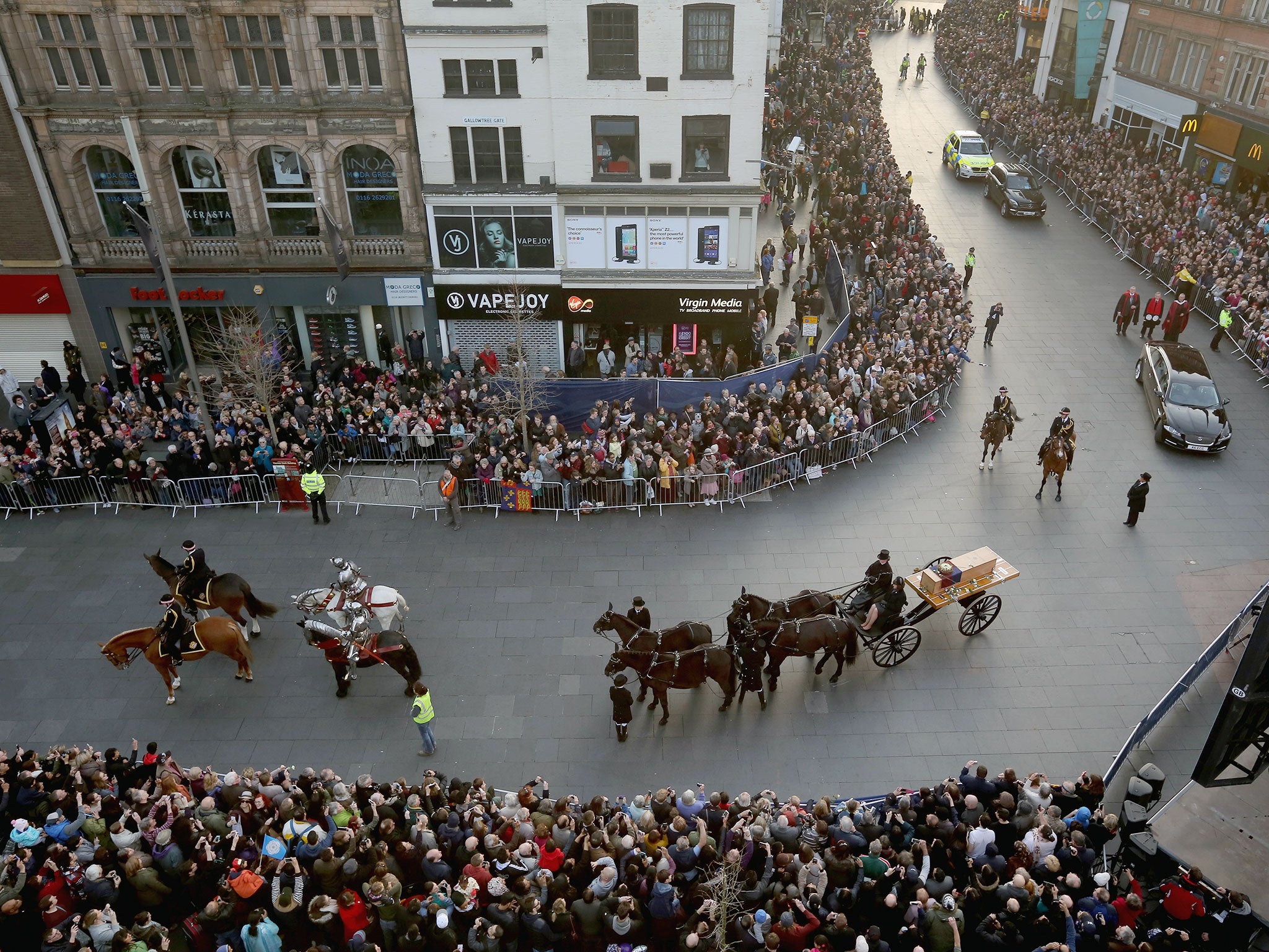 The coffin containing the remains of King Richard III is carried in procession for interment at Leicester Cathedral in Leicester