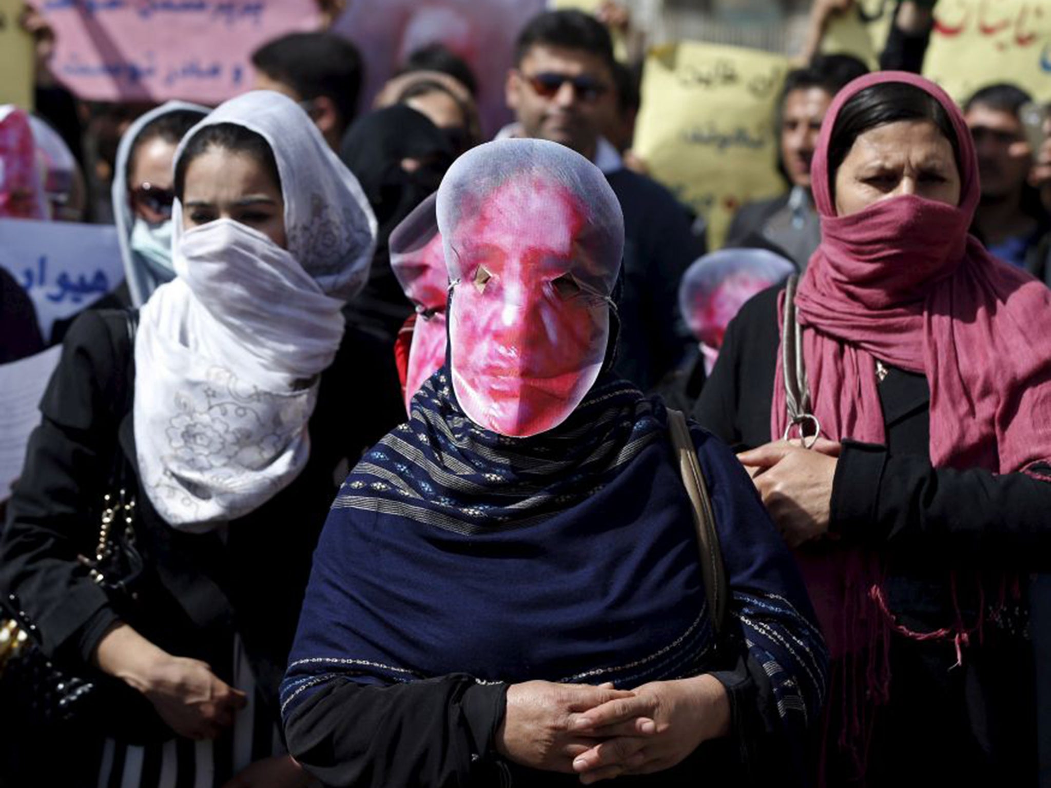 Afghans protesting yesterday against the killing of a woman, 27, accused of destroying a Koran last week