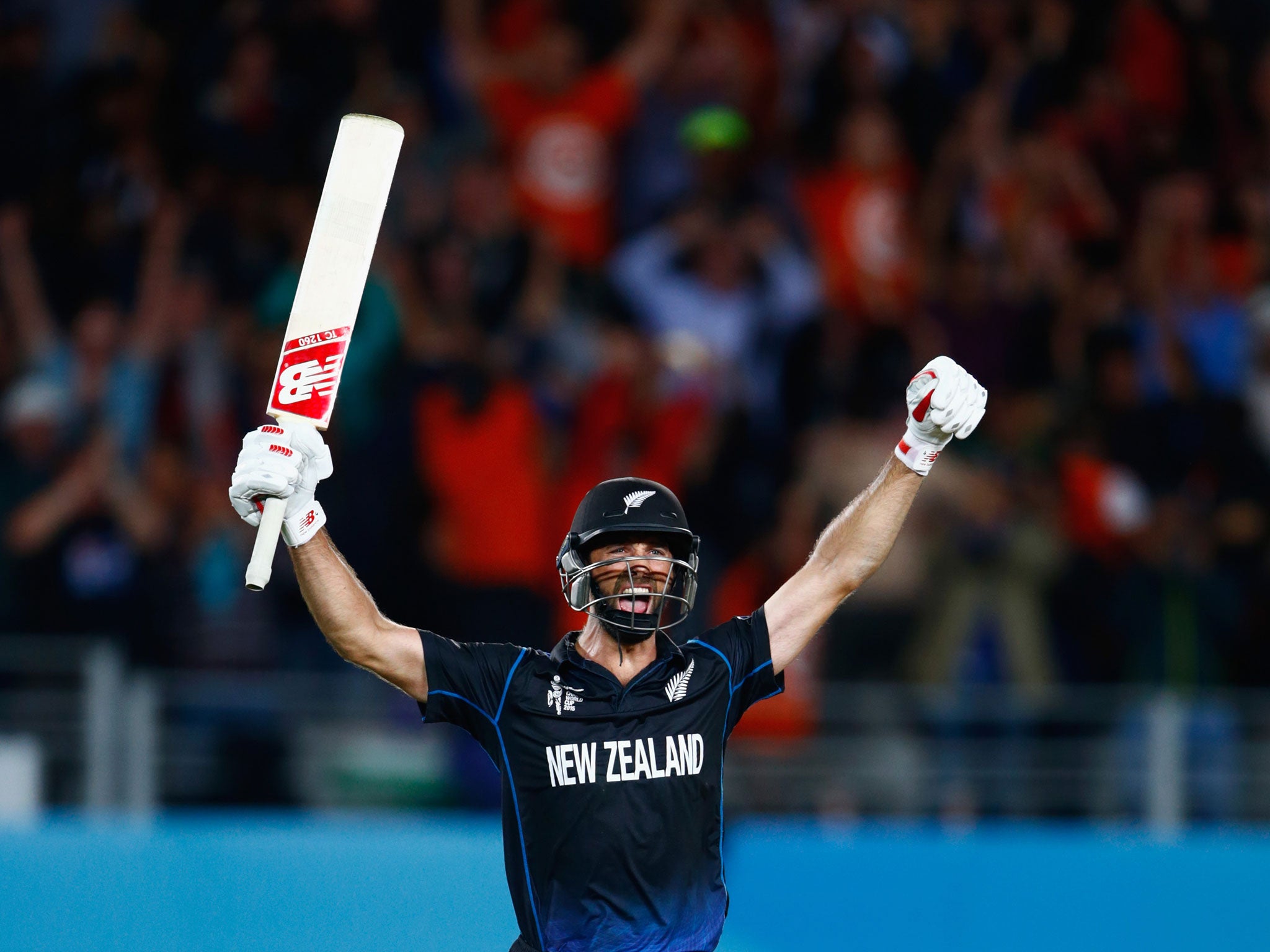 Grant Elliott celebrates hitting a six to win the Cricket World Cup semi-final against South Africa