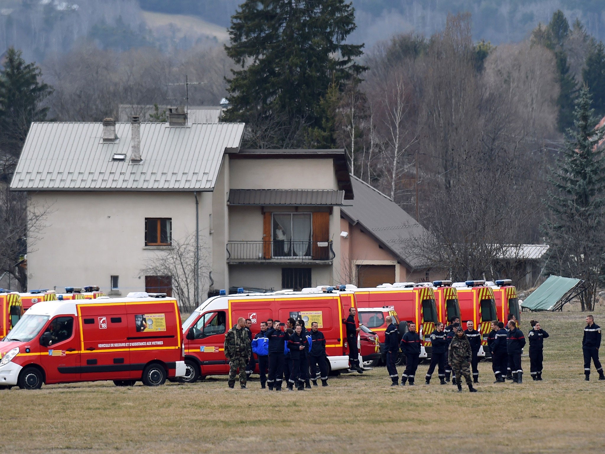 French emergency services workers gather in Seyne, south-eastern France, near the site where a Germanwings Airbus A320 crashed in the French Alps