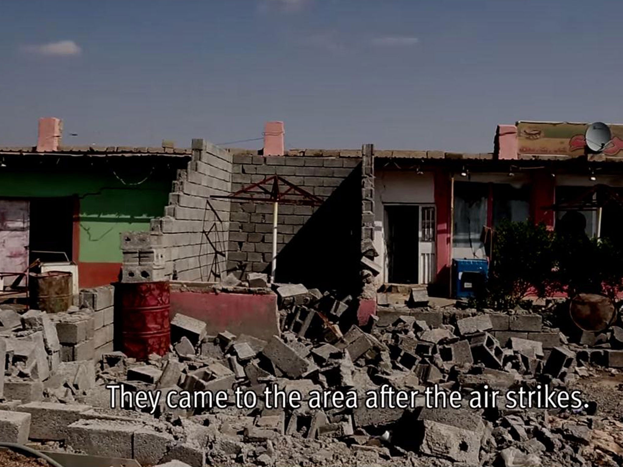 A Peshmerga soldier shows HRW one of the homes allegedly destroyed by militias