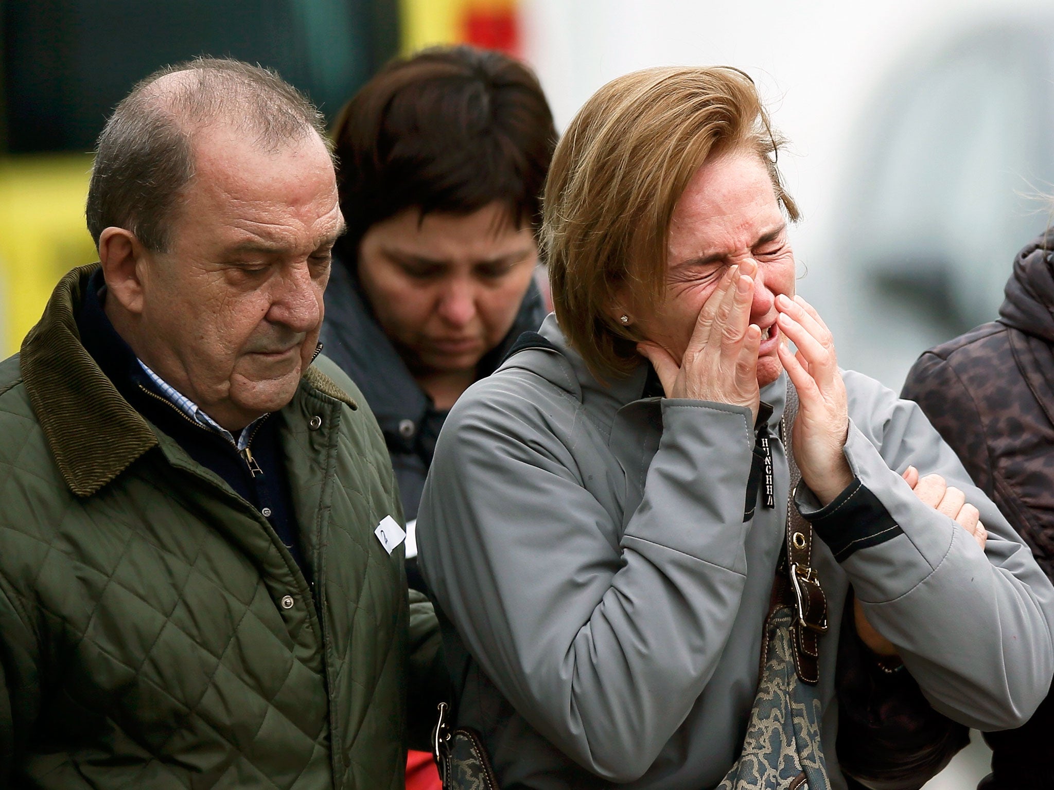 Family members of passengers feared killed in Germanwings plane crash react at Barcelona's El Prat airport